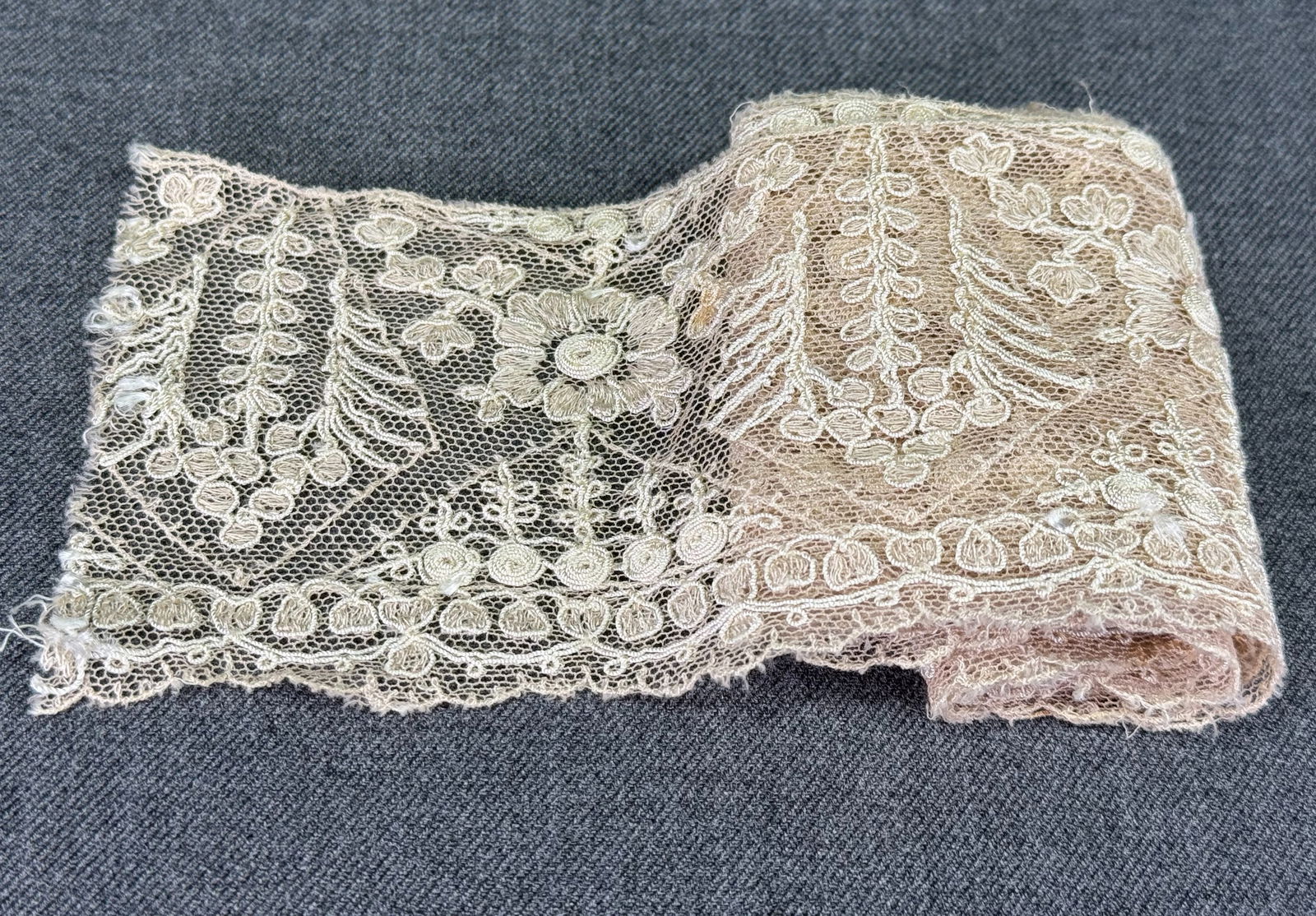 Antique embroidery flowers tulle lace trim.: Antique embroidery flowers tulle lace trim. .27 inches long . For measures please refer to the pictures taken with a measuring tape. IN HOUSE Estimated* shipping and handling cost within the U.S. : $7