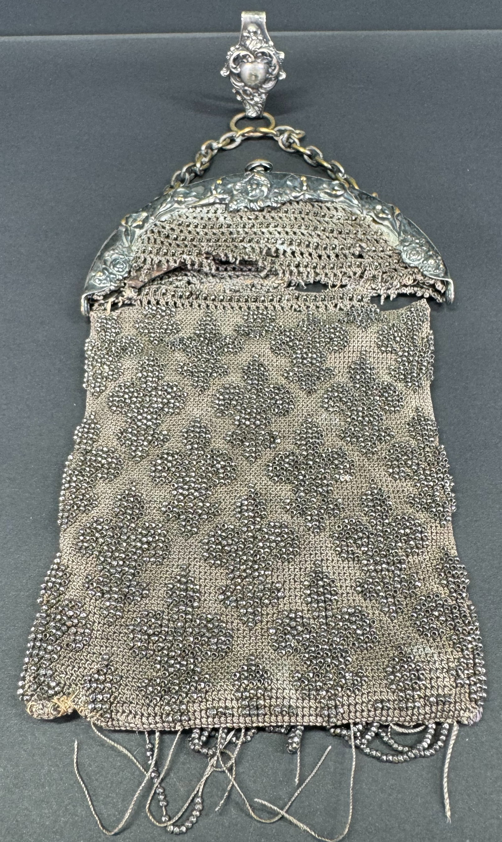 Antique Victorian embroidery with steel beads fleur del lis crocheted purse bag.: Antique Victorian embroidery with steel beads fleur del lis crocheted purse bag. Frame decorated with a woman & flowers and chain with clip for chatelaine. Marked on clip and in frame German Silver. T