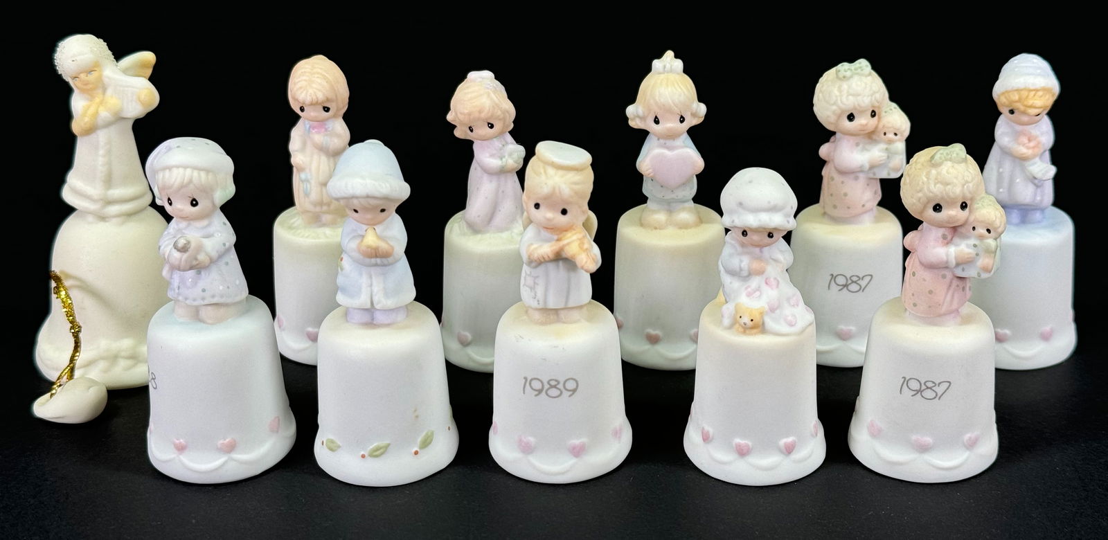 Vintage Samuel J. Butcher Enesco Precious Moments Thimbles a lot of 10 & unbranded bell.: Vintage Samuel J. Butcher Enesco Precious Moments Thimbles a lot of 10 & unbranded bell. The thimbles are marked, the bell is not. For measures please refer to the pictures taken with a measuring tape