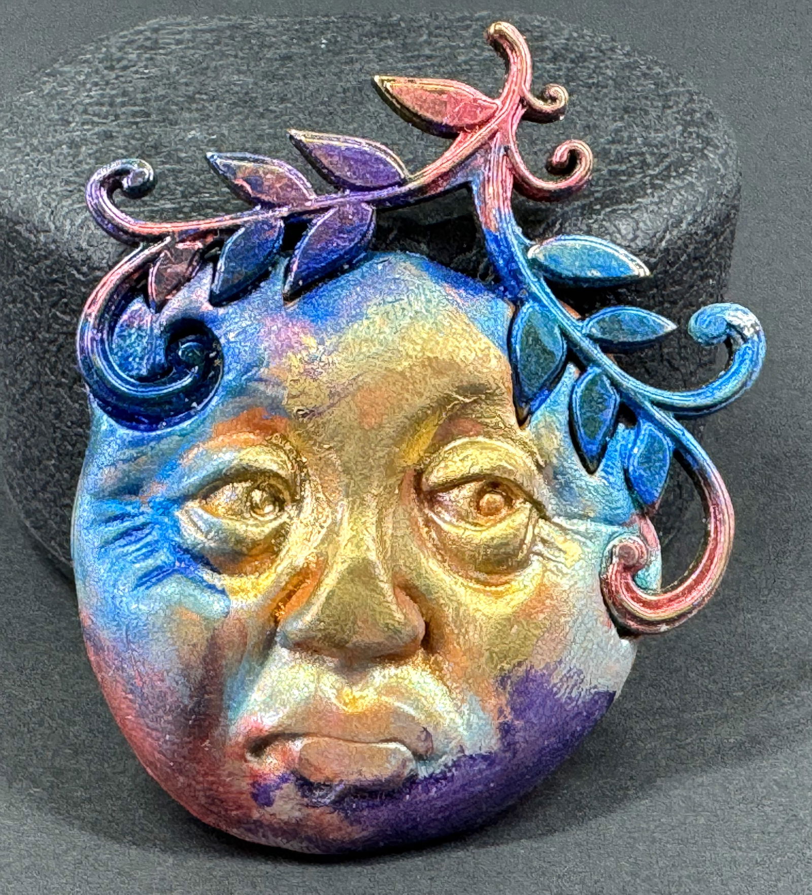 Vintage artsy iridescent clay polymer moon face & metal leaves branch pendant.: Vintage artsy iridescent clay polymer moon face & metal leaves branch pendant. For measures please refer to the pictures taken with a measuring tape. Weight: 14 Grams. This is a NO RESERVE AUCTION: th