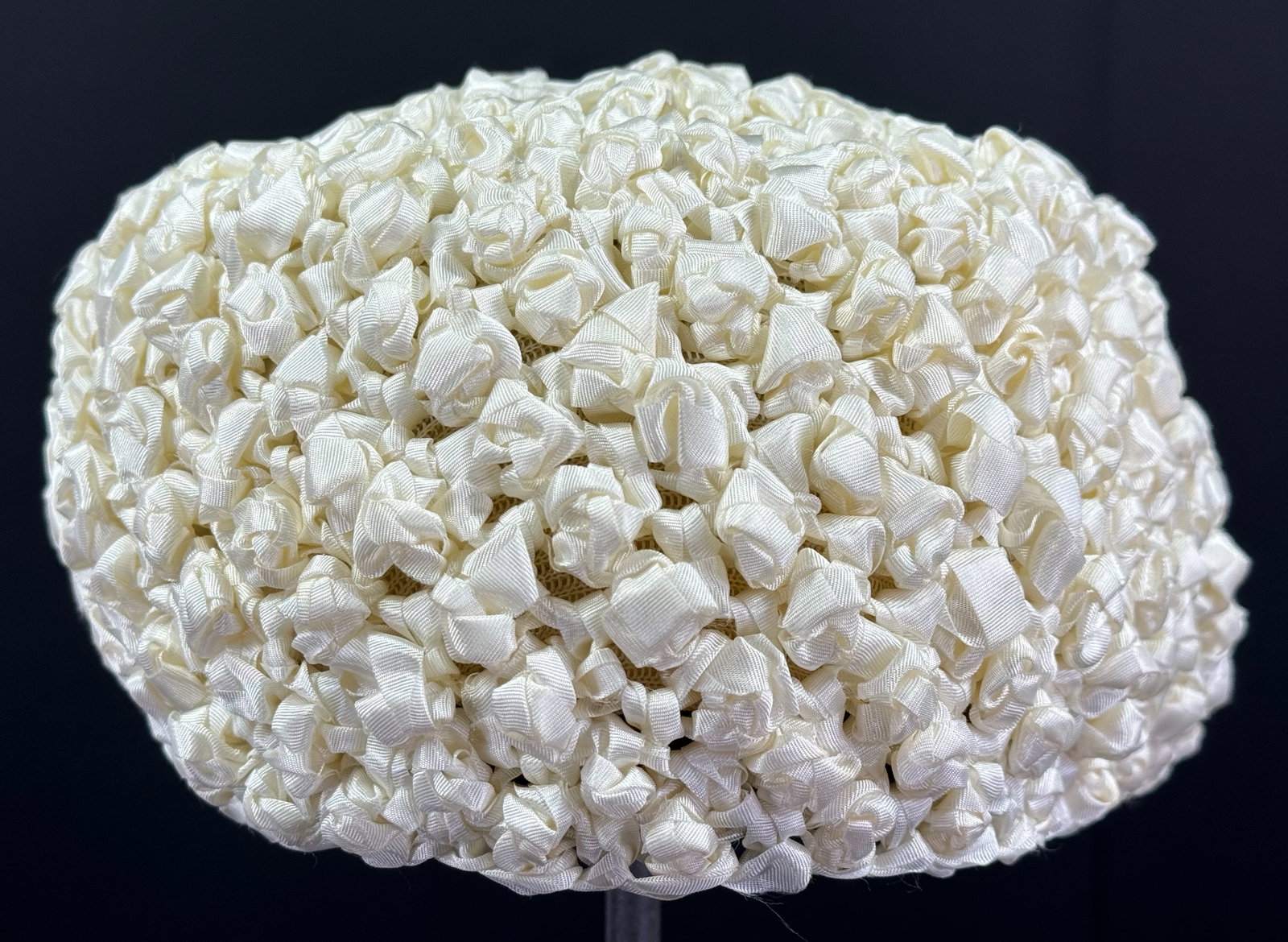 Vintage hand knotted creamy white silky grosgrain ribbon hat.: Vintage hand knotted creamy white silky grosgrain ribbon hat. No label. No size label. It measures around 20 inches of interior circumference. This is a NO RESERVE AUCTION: there are no hidden or conf