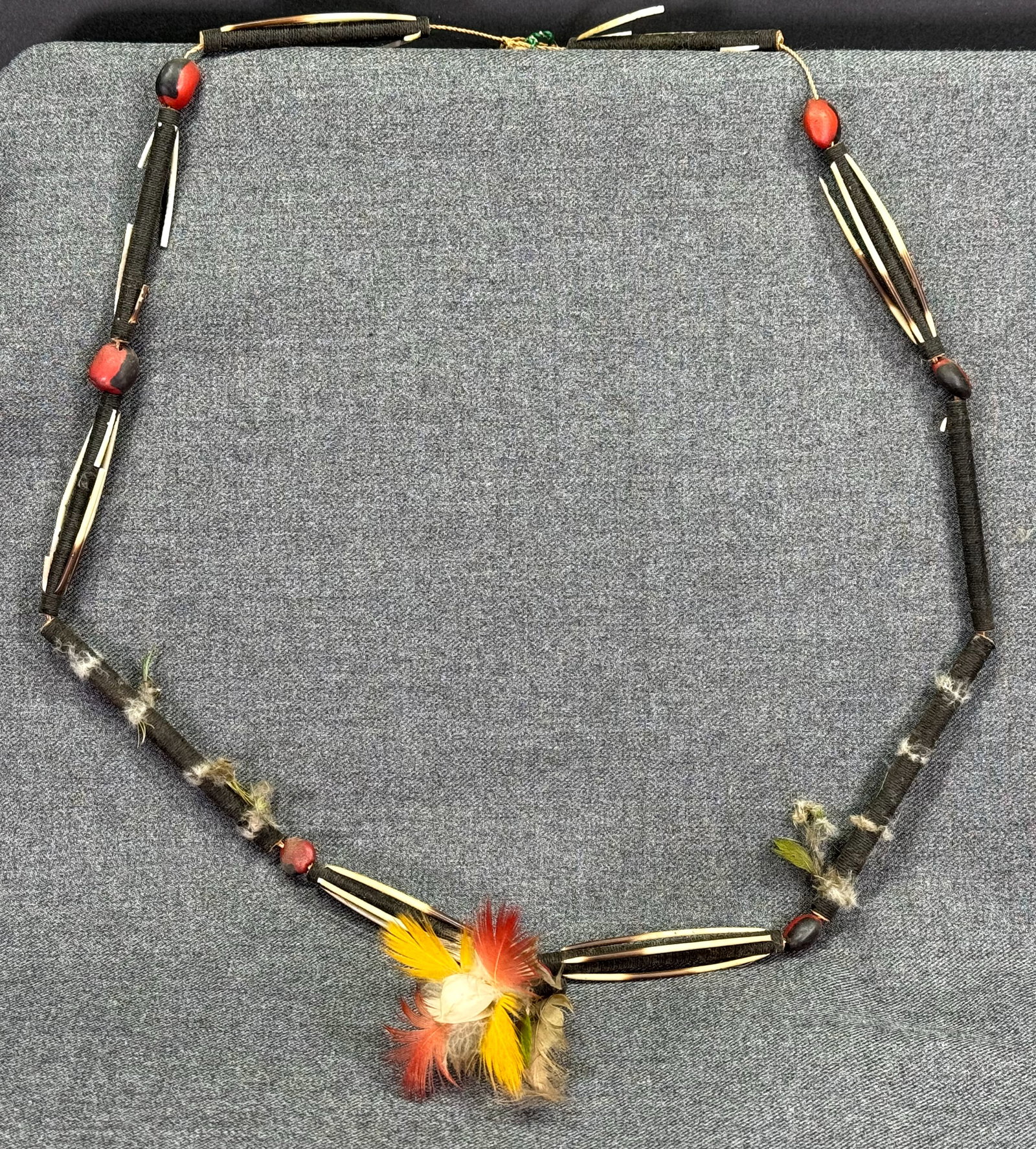 Amazonian Bororo Necklace. Feathers, wrapped cane, seeds, porcupine quills, cord. FUNAI old label: Amazonian Bororo Necklace. Feathers, wrapped cane, seeds, porcupine quills, cord. Old paper label from FUNAI ( National Indian Foundation ) For measures please refer to the pictures taken with a measu