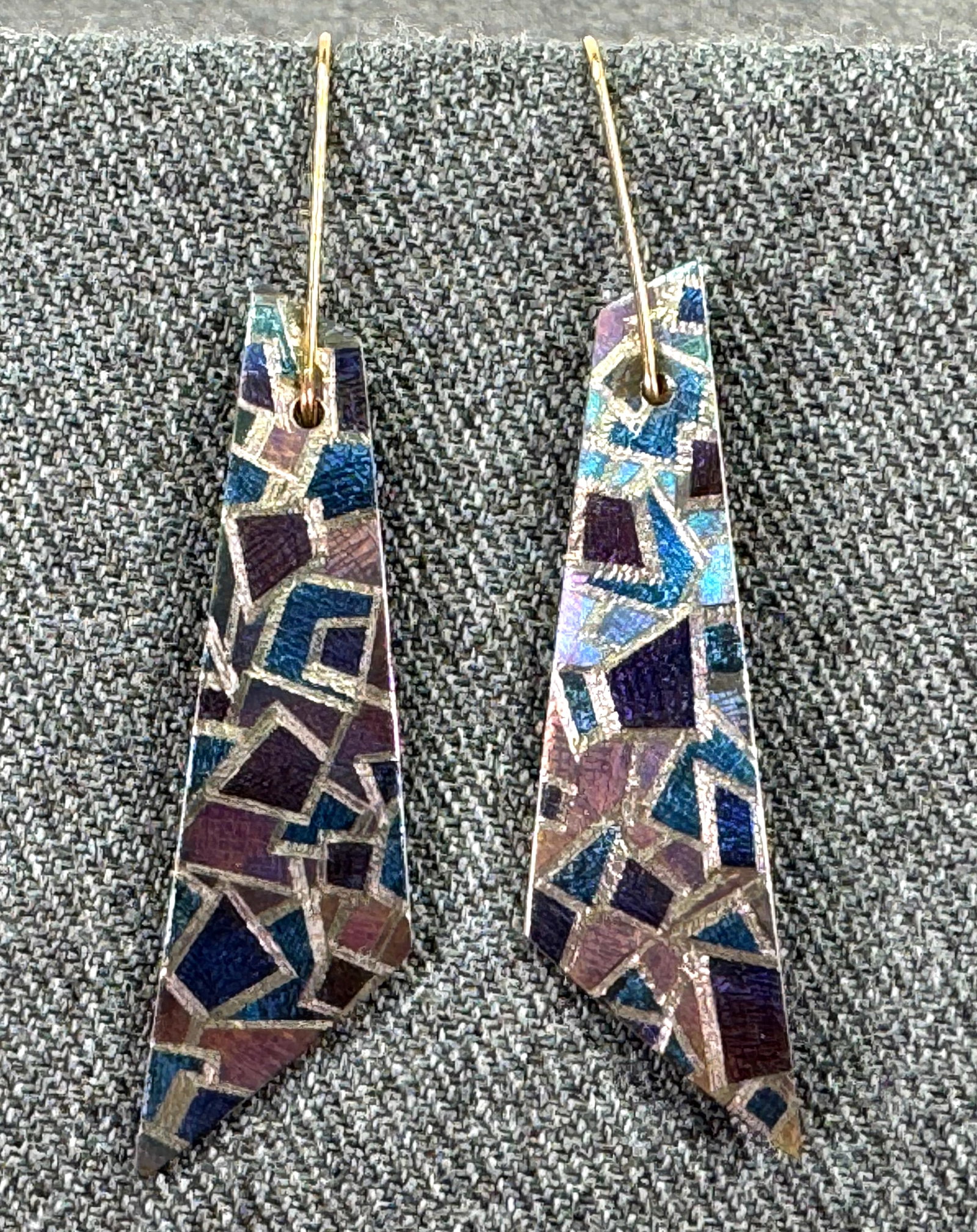 Vintage constructivist style signed anodized titanium hook earrings: Vintage constructivist style signed anodized titanium hook earrings. Hand engraved signature. For measures please refer to the pictures taken with a measuring tape. Weight: 3 Grams. IN HOUSE Estimated