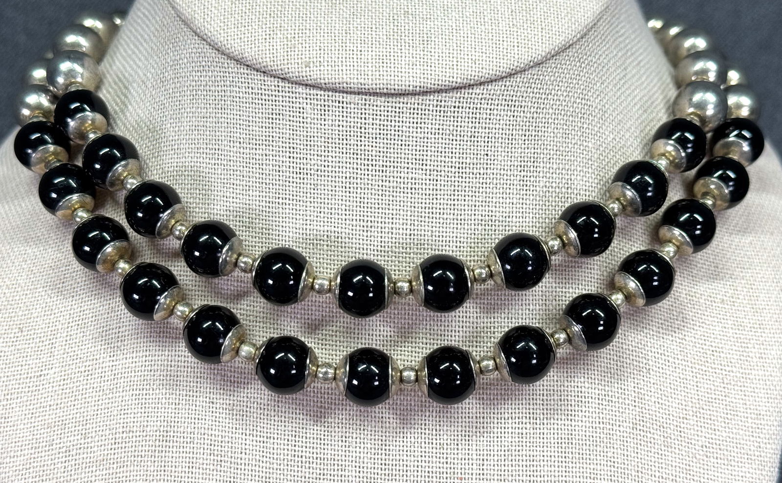 Vintage Liz Claiborne black and silvertoned plastic beaded necklace.: Vintage Liz Claiborne black and silvertoned plastic 2 strands beaded necklace. Marked. For measures please refer to the pictures taken with a measuring tape. Weight: 40 Grams. IN HOUSE Estimated* SHIP
