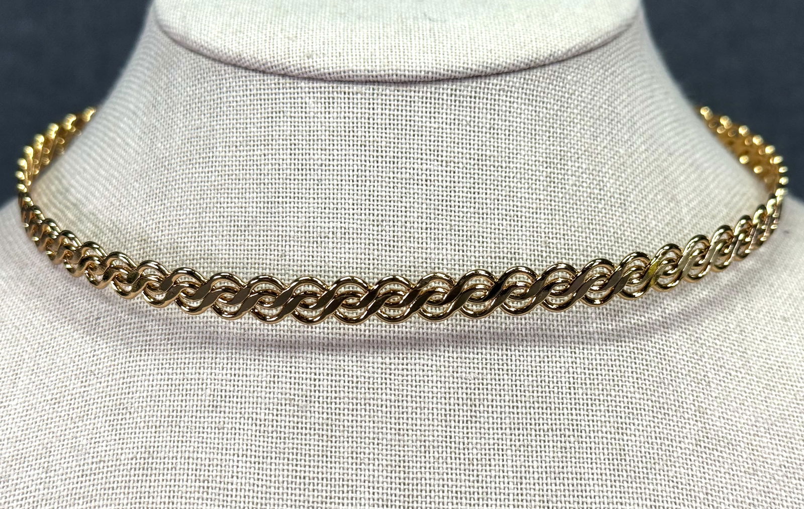 Vintage Napier woven goldtoned metal rigid ring collar: Vintage Napier woven goldtoned metal rigid ring collar. Marked. For measures please refer to the pictures taken with a measuring tape. Weight: 23 Grams. IN HOUSE Estimated* SHIPPING & HANDLING COST WI