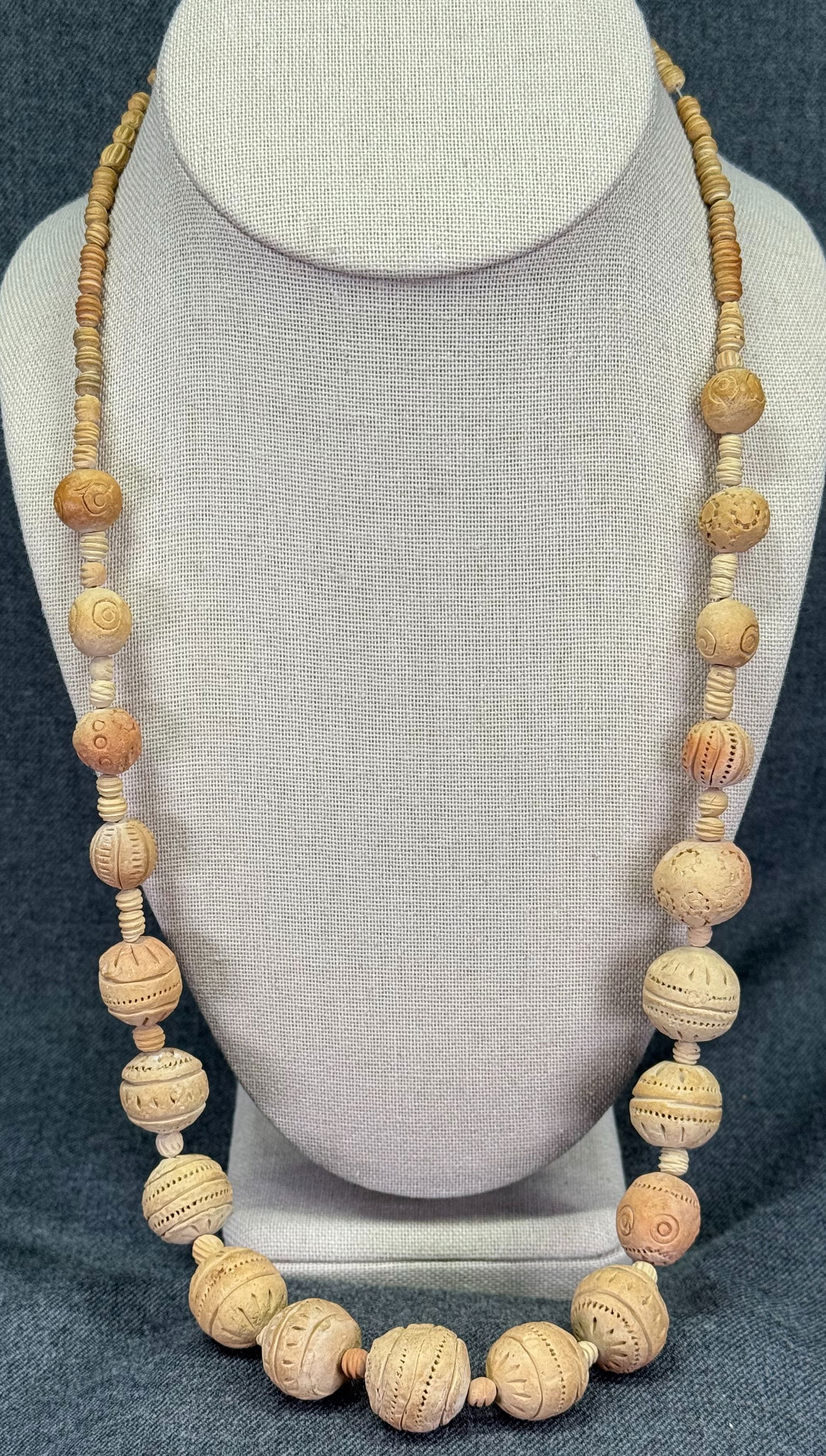 Vintage folk ethnic terracotta beaded necklace: Vintage folk ethnic terracotta beaded necklace. Unmarked. For measures please refer to the pictures taken with a measuring tape. Weight: 33 Grams. IN HOUSE Estimated* SHIPPING & HANDLING COST WITHIN T