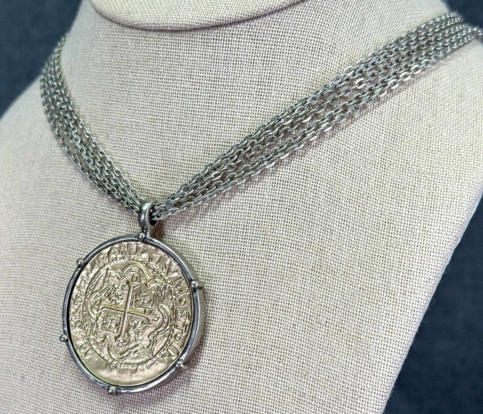 Vintage golden faux coin medal silvertoned multi chain necklace: Vintage golden faux coin medal silvertoned multi chain necklace. Unmarked. For measures please refer to the pictures taken with a measuring tape. Weight: 31 Grams. IN HOUSE Estimated* SHIPPING & HANDL