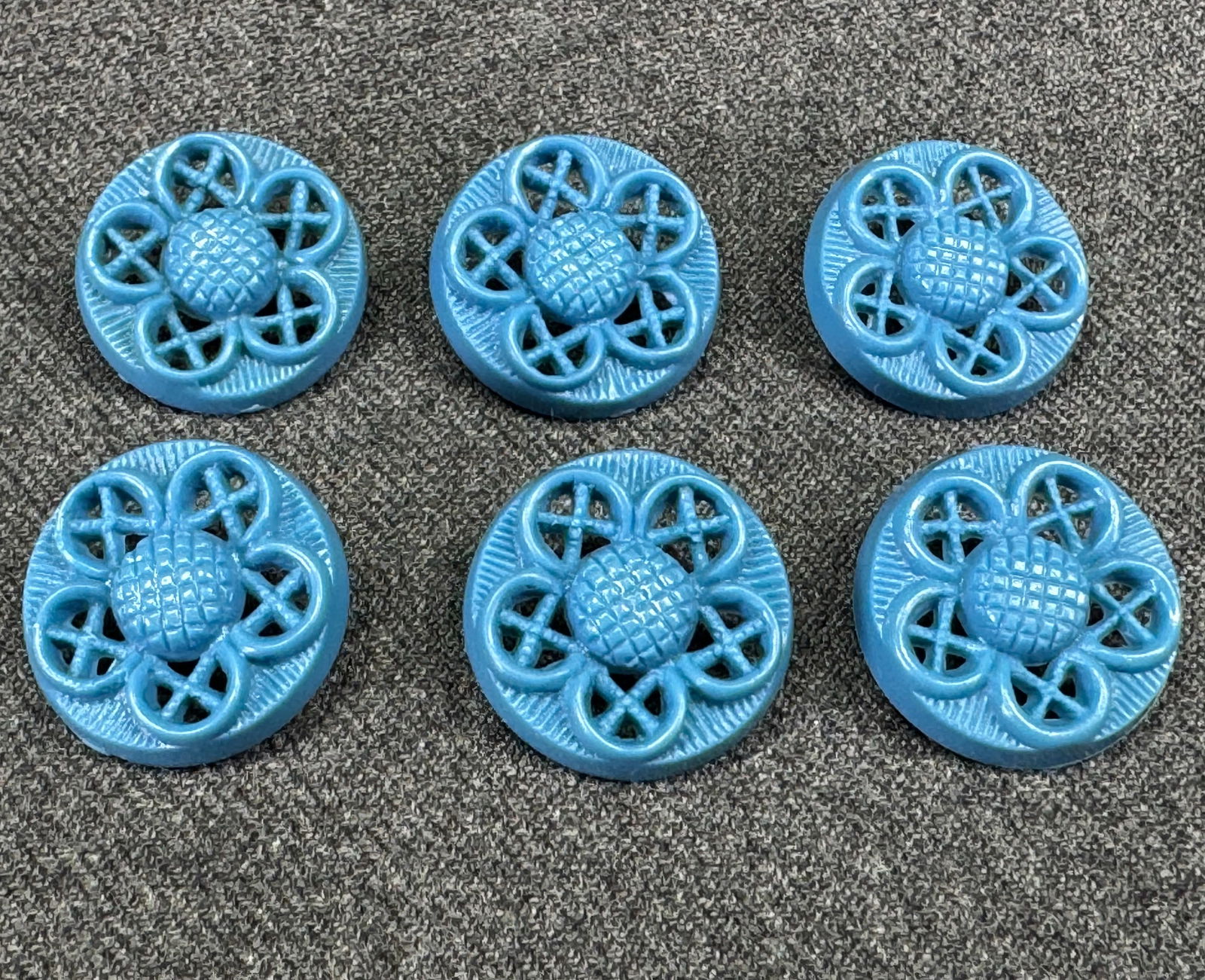Vintage filigree light blue plastic flower buttons. Lot of 6: Vintage filigree light blue plastic flower buttons. Lot of 6. For measures please refer to the pictures taken with a measuring tape. IN HOUSE Estimated* shipping and handling cost within the U.S. : $7