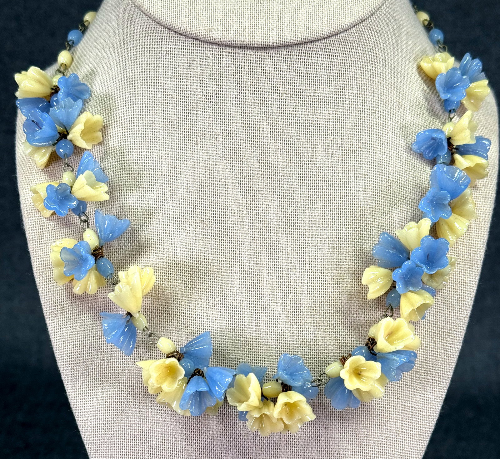 Vintage Murano wired lavender & pale yellowish glass flowers necklace: Vintage Murano wired lavender & pale yellowish glass flowers necklace. Unmarked. For measures please refer to the pictures taken with a measuring tape. Weight: 34 Grams. IN HOUSE Estimated* SHIPPING &