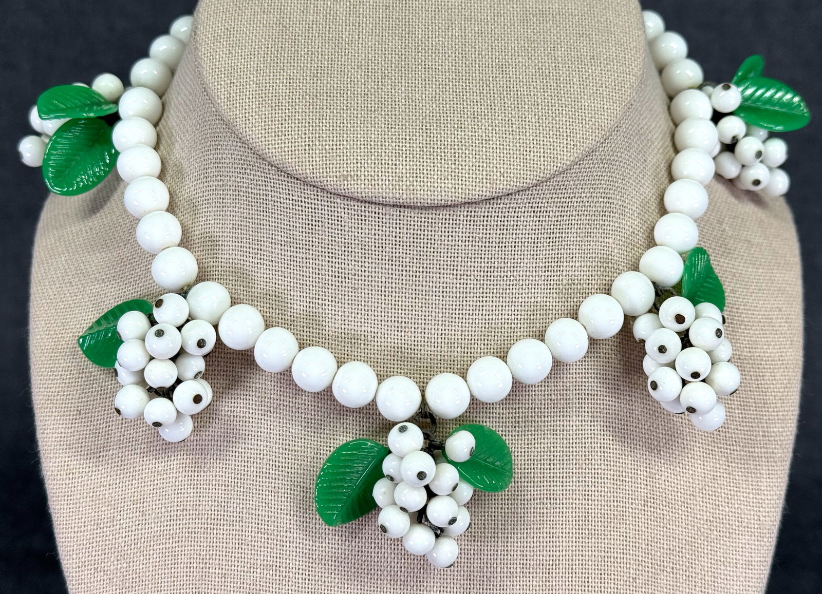 Vintage green leaves milky white glass clusters beaded necklace.: Vintage green leaves milky white glass clusters beaded necklace. Unmarked. For measures please refer to the pictures taken with a measuring tape. Weight: 74 Grams. IN HOUSE Estimated* SHIPPING & HANDL