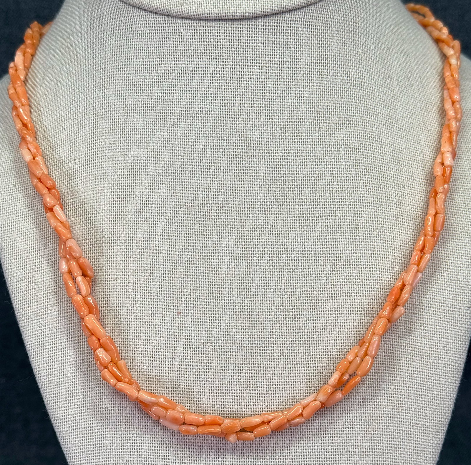 Vintage angel skin coral graduated twisted beads 3 strands necklace.: Vintage angel skin coral graduated twisted beads 3 strands necklace. Goldtoned metal clasp. Unmarked. For measures please refer to the pictures taken with a measuring tape. Weight: 16 Grams. IN HOUSE 
