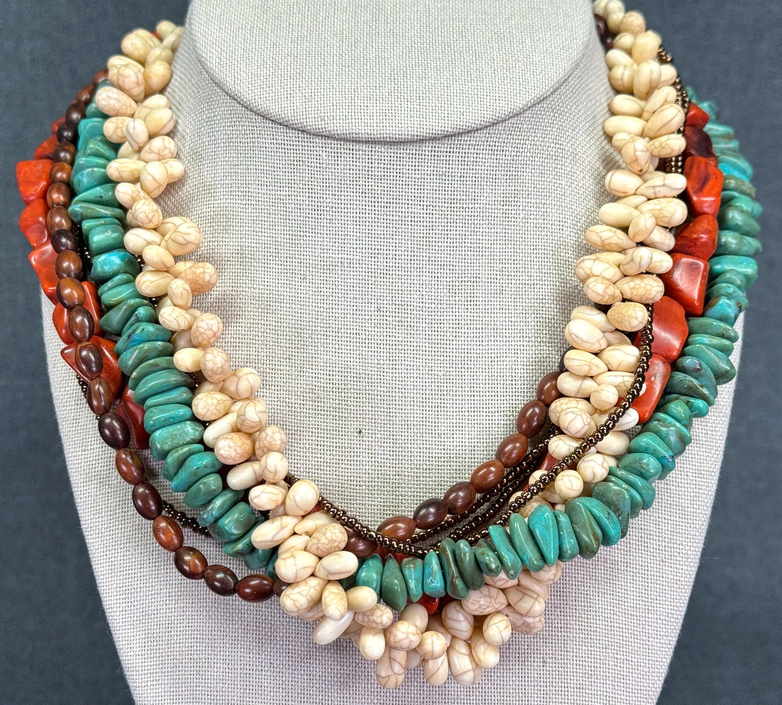 Vintage boho faux coral, turquoise & others stones plastic multi strand necklace: Vintage boho faux coral, turquoise & others stones plastic multi strand necklace. Unmarked. For measures please refer to the pictures taken with a measuring tape. Weight: 114 Grams. IN HOUSE Estimated