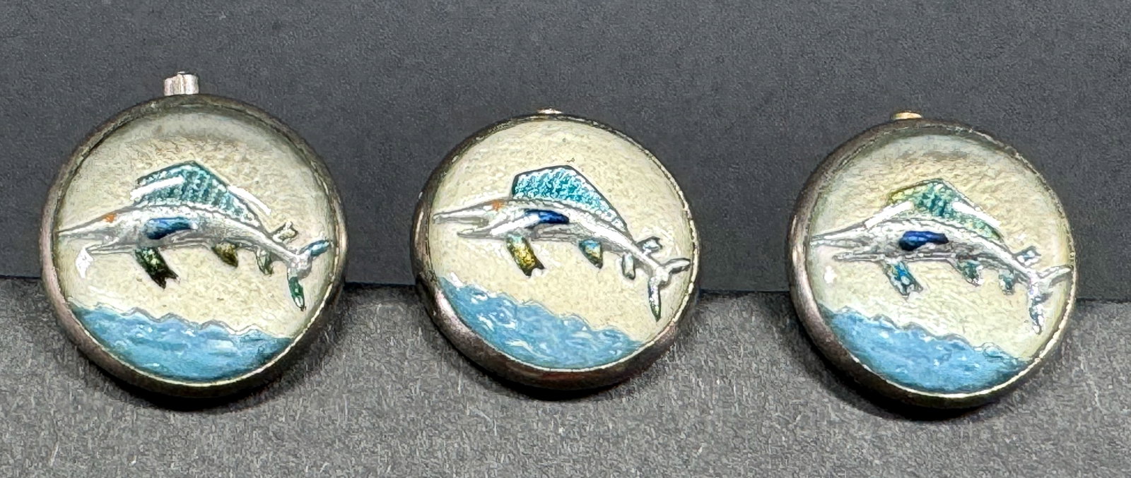 Vintage Essex crystal swordfish silvertone metal studs. Lot of 3. Marked: Vintage Essex crystal swordfish silvertone metal studs. Lot of 3. Marked The FF Brand Made in USA. For measures please refer to the pictures taken with a measuring tape. Weight: 6 Grams . This is a NO