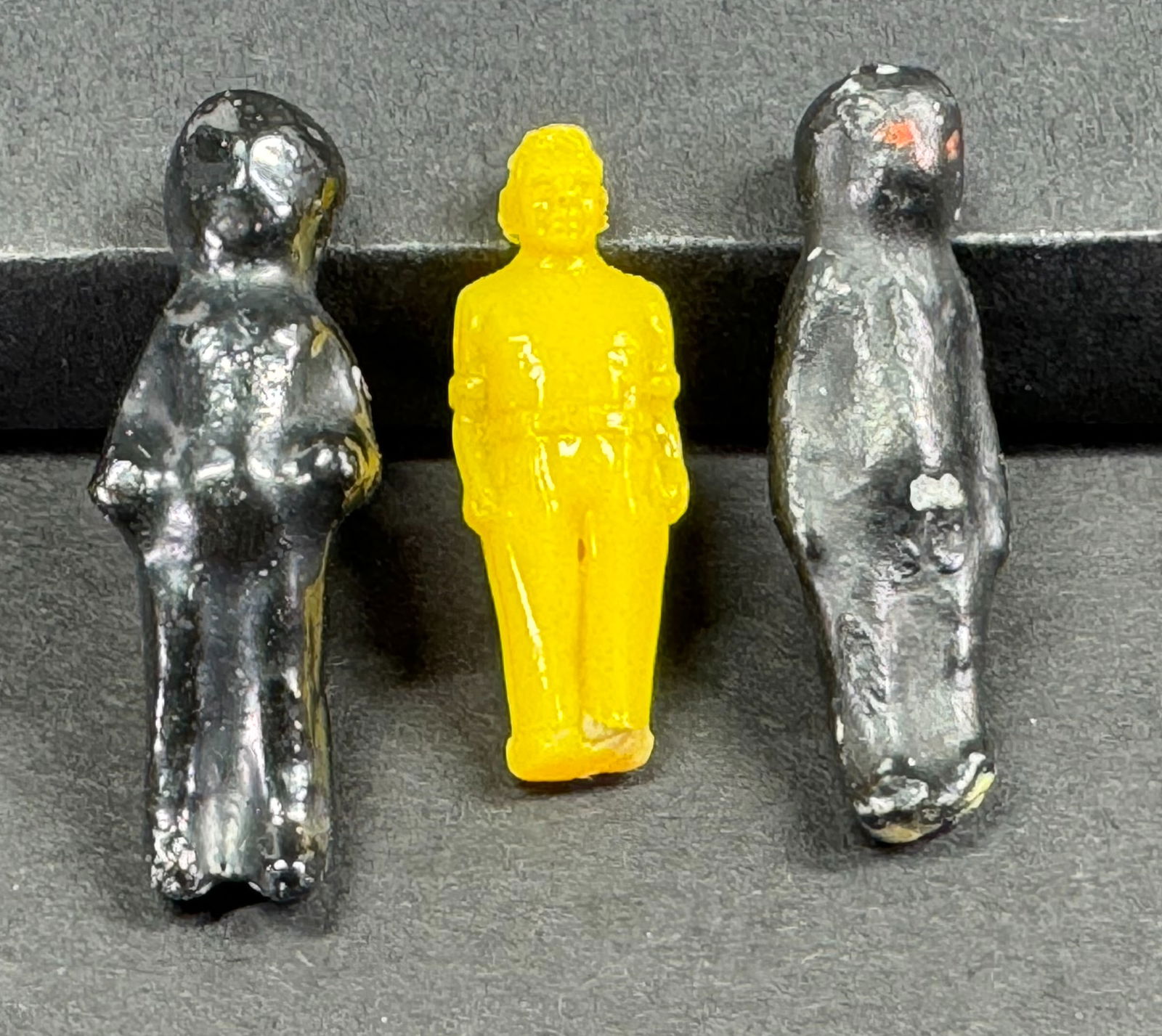 Vintage painted black plastic? Charlotte style & yellow plastic man miniature tiny dolls.: Vintage painted black plastic? Charlotte style & yellow plastic man miniature tiny dolls. Lot of 3. < This is a NO RESERVE AUCTION: there are no hidden or confidential reserves, all acceptable bidding