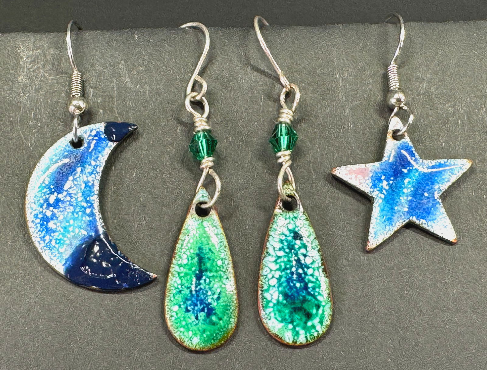 Enamel copper Susan Creations drop & star and crescent moon hook earrings.: Enamel copper Susan Creations drop & star and crescent moon hook earrings. The drop ones are marked and dated 2016 and the other ones are unmarked. For measures please refer to the pictures taken with