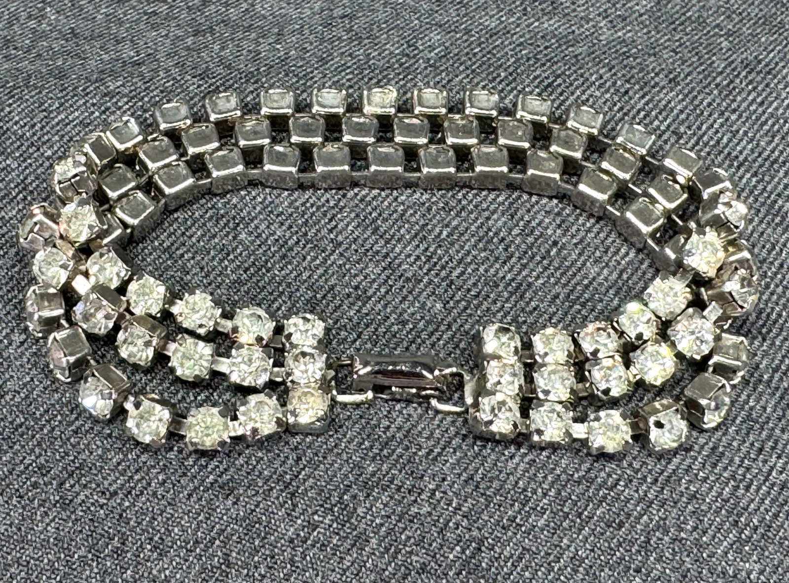 Vintage clear rhinestones silvertone metal 3 strands bracelet: Vintage clear rhinestones silvertone metal 3 strands bracelet. Unmarked. For measures please refer to the pictures taken with a measuring tape. Weight: 17 Grams. IN HOUSE Estimated* shipping and handl