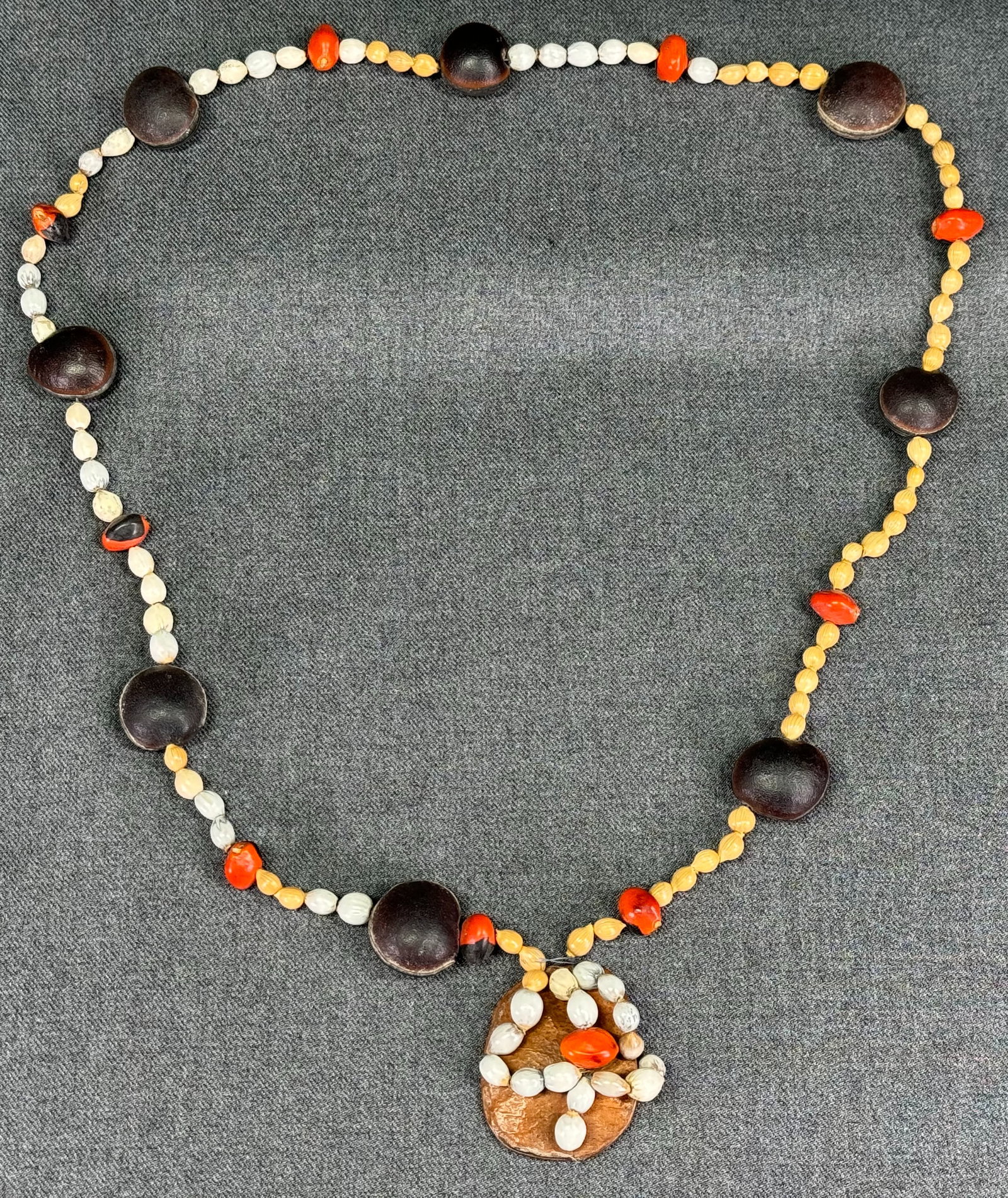 Vintage tribal seeds necklace.: Vintage tribal seeds necklace. For measures please refer to the pictures taken with a measuring tape. Weight: 44 Grams. This is a NO RESERVE AUCTION: there are no hidden or confidential reserves, all 