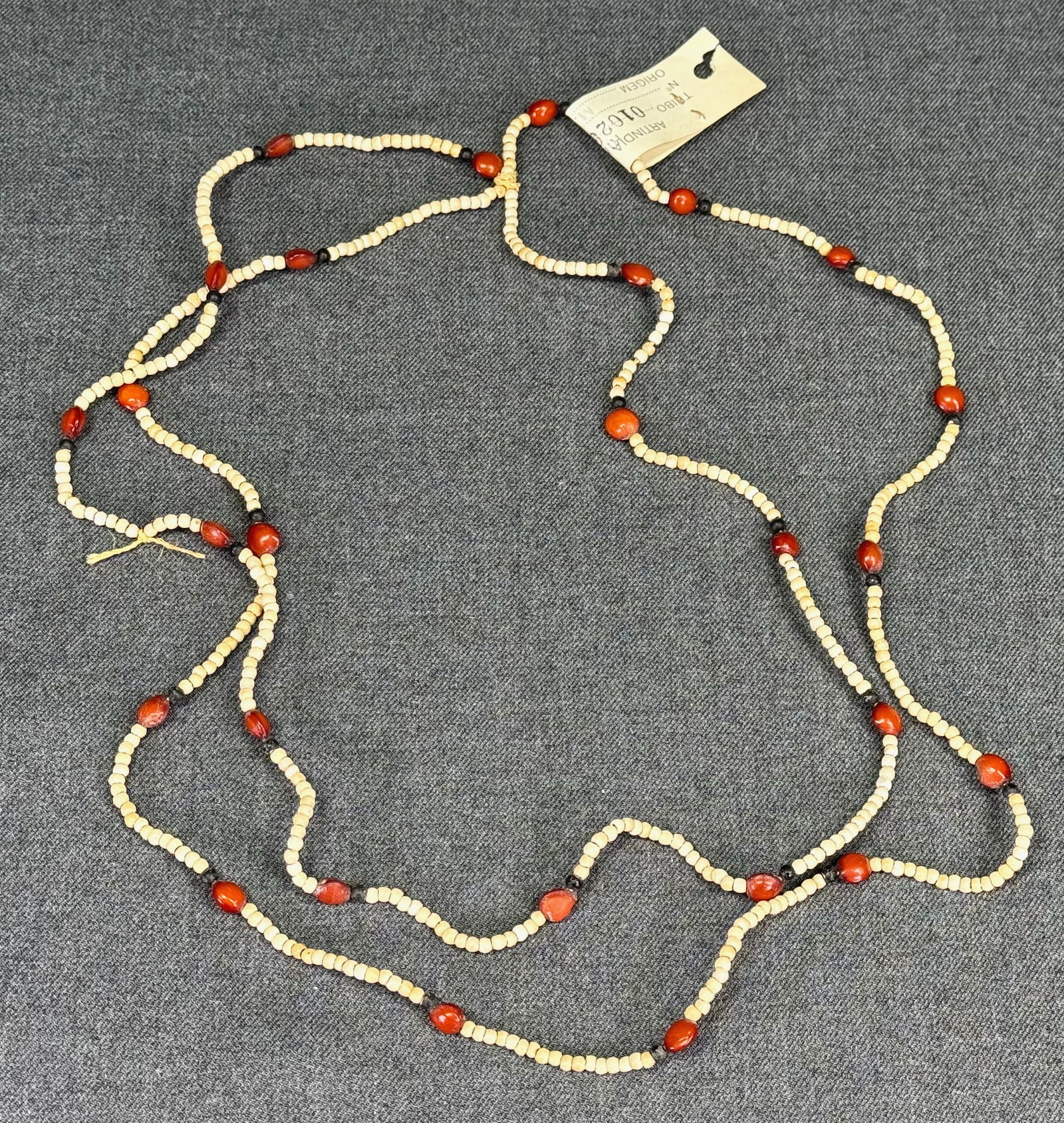 Amazonian Rikbaktsa Necklace. Seeds, cord. FUNAI old paper label: Amazonian Rikbaktsa Necklace. Seeds, cord. Old paper label from FUNAI ( National Indian Foundation ). For measures please refer to the pictures taken with a measuring tape. IN HOUSE Estimated* shippin