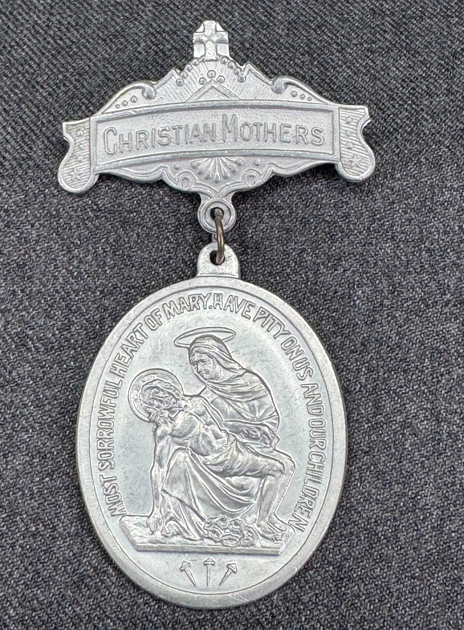 Vintage Christian Mothers Saint Joseph / Our lady dangle medal brooch pin: Vintage Christian Mothers Saint Joseph / Our lady dangle medal brooch pin. Unmarked. For measures please refer to the pictures taken with a measuring tape. Weight: 9 Grams. IN HOUSE Estimated* SHIPPIN