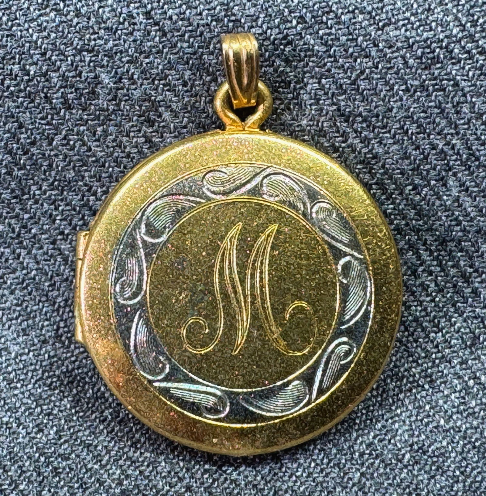 Vintage H+B rose glitter accents 12K gold-filled engraved letter M locket pendant: Vintage H+B rose glitter accents 12K gold-filled engraved letter M locket pendant. Marked 1/20 12K H+B. For measures please refer to the pictures taken with a measuring tape. Weight: 5 Grams. IN HOUSE
