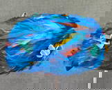 Vintage turquoise, yellow & reddish orange feathers hat. Velvet appliques