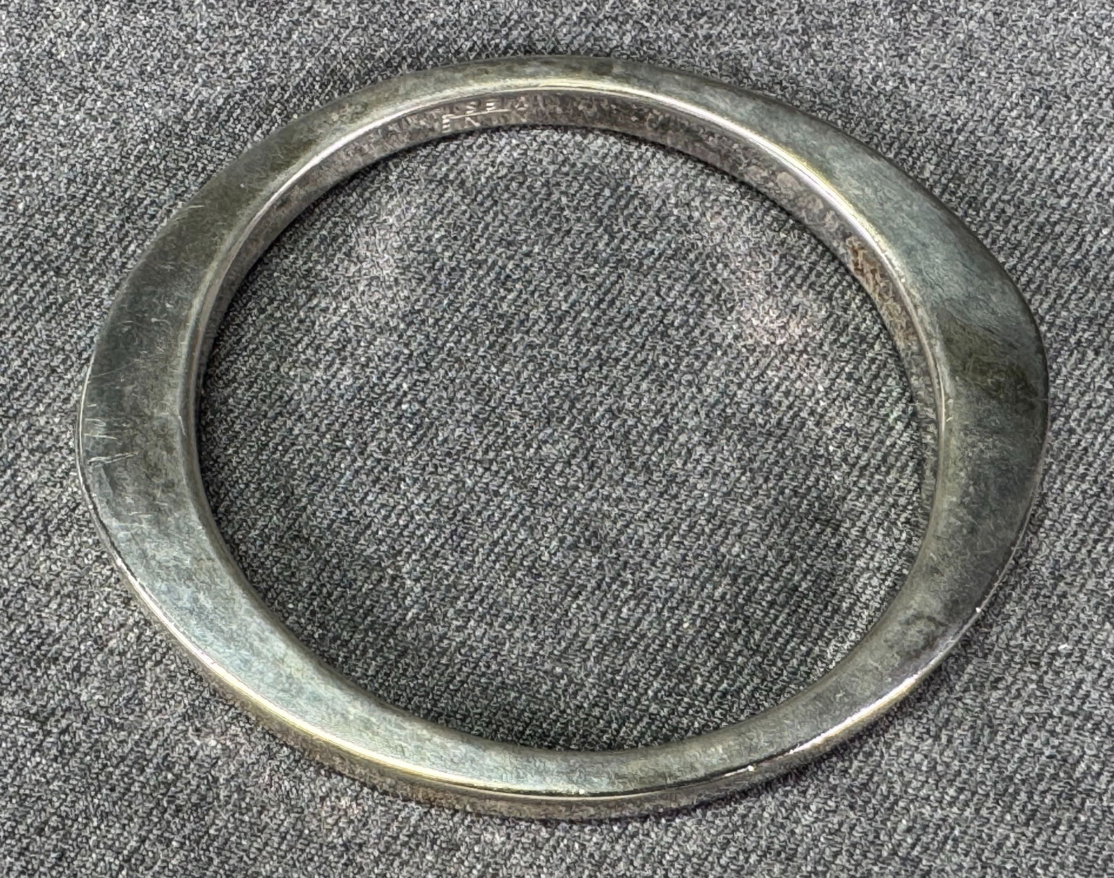 Vintage Nine West aged silver color space age shaped bracelet: Vintage Nine West aged silver color space age shaped heavy bracelet. Marked. For measures please refer to the pictures taken with a measuring tape. Weight: 80 Grams. IN HOUSE Estimated* SHIPPING & HAN