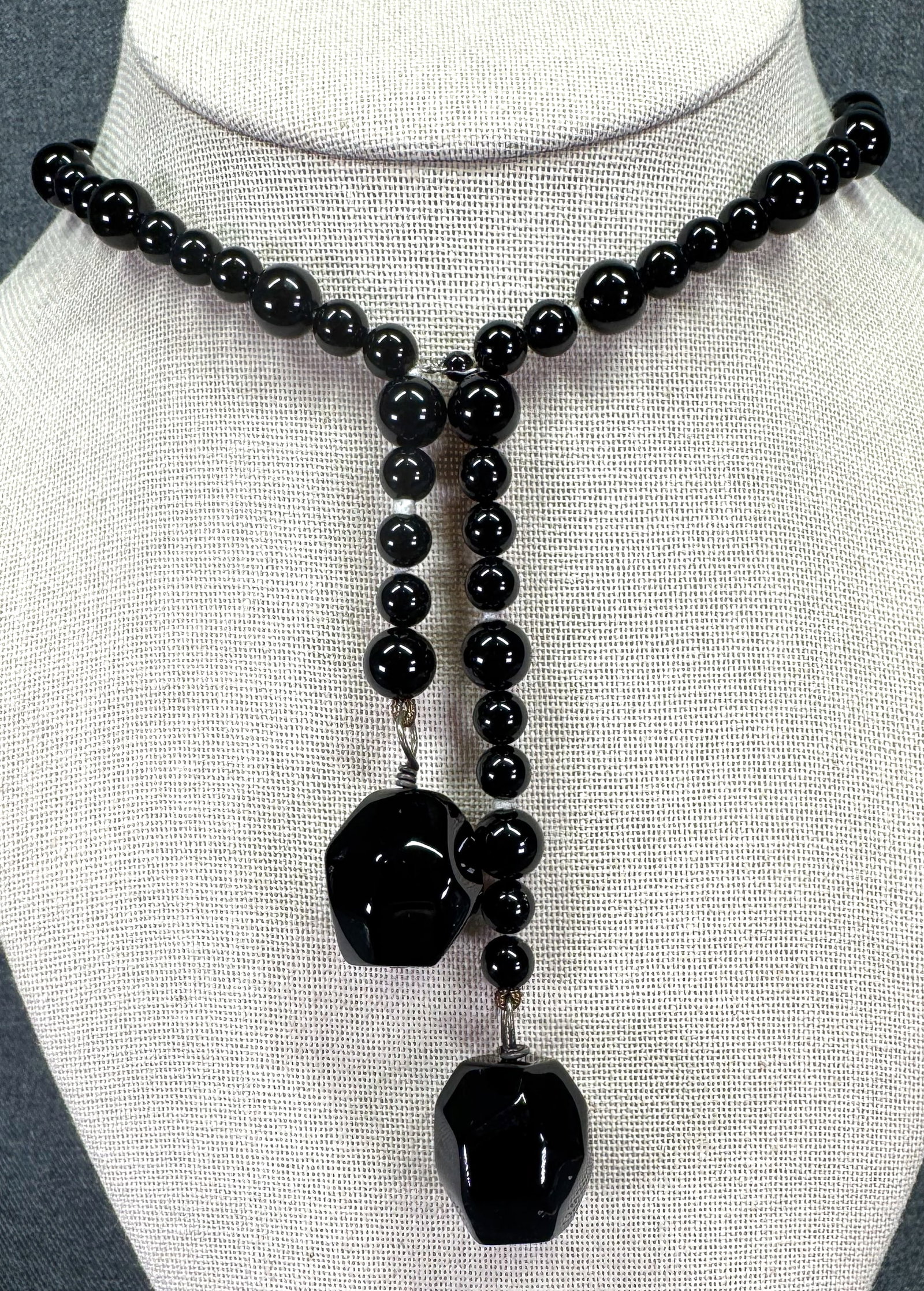 Vintage black glass beaded with 2 ball dangles. Sterling silver clasp: Vintage black glass beaded with 2 ball dangles. Sterling silver clasp. Clasp marked 925. For measures please refer to the pictures taken with a measuring tape. IN HOUSE Estimated* SHIPPING & HANDLING 
