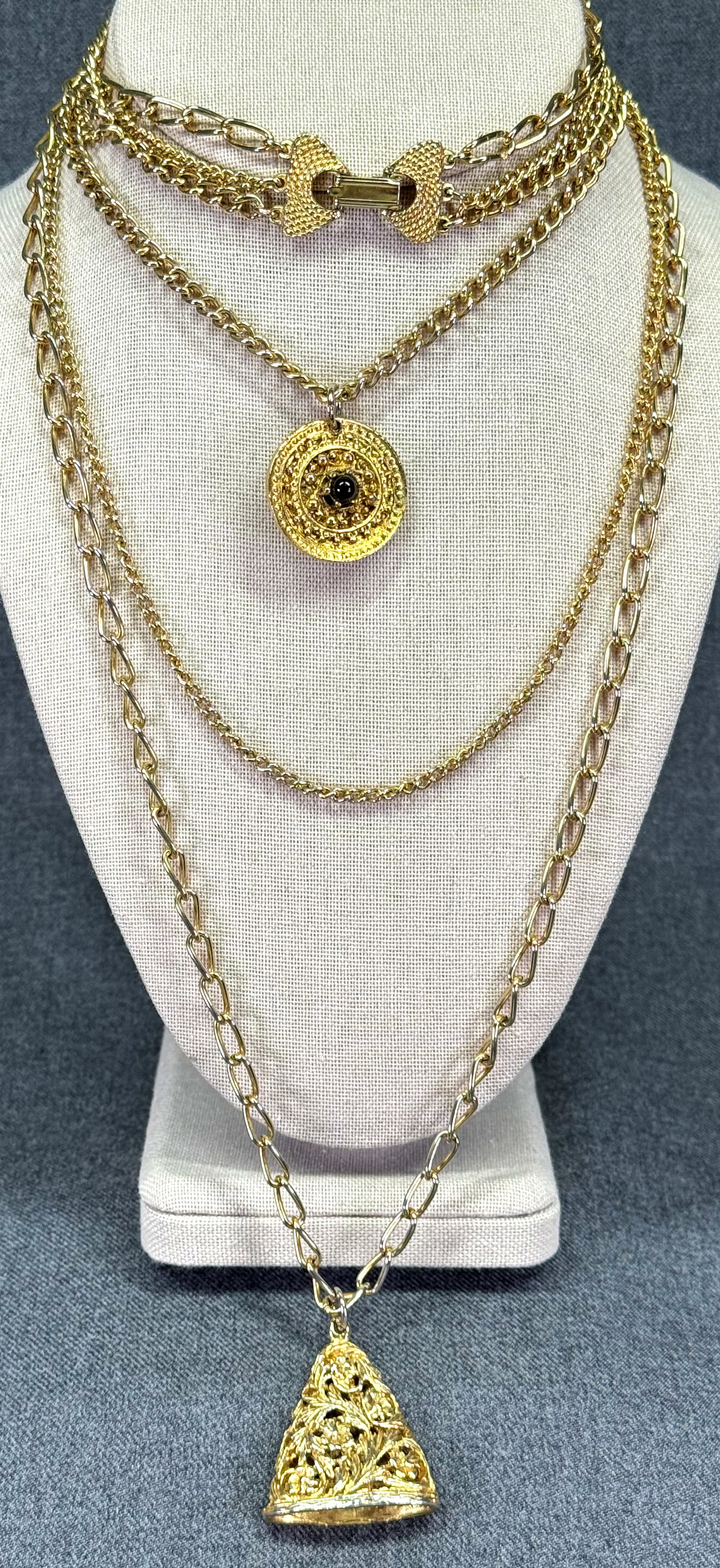 Vintage Goldette gold-toned metal 3 strands necklace with two pendants: Vintage Goldette gold-toned metal 3 strands necklace with two pendants. Unmarked. For measures please refer to the pictures taken with a measuring tape. Weight: 83 Grams IN HOUSE Estimated* SHIPPING &