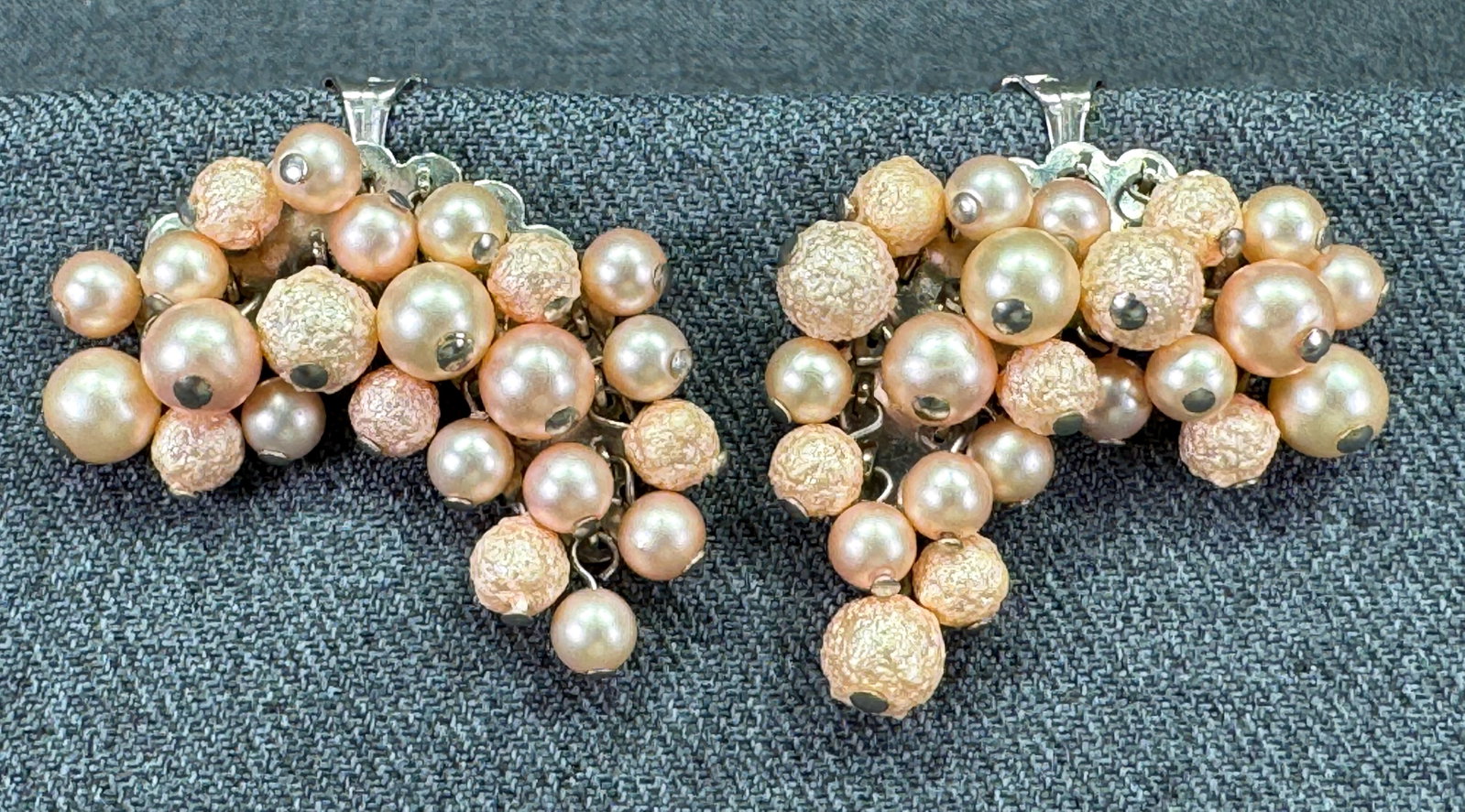 Vintage peach pearly & sugar coated beads dangles clip on earrings: Vintage peach pearly & sugar coated beads dangles silver-toned clip on earrings. Unmarked. For measures please refer to the pictures taken with a measuring tape. Weight: 19 Grams. IN HOUSE Estimated* 