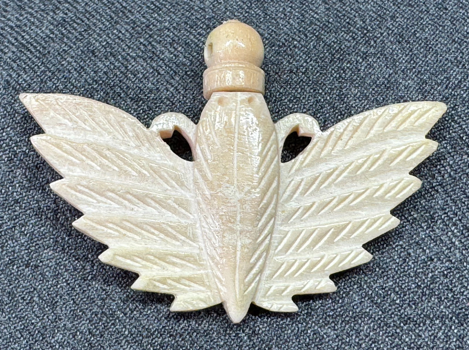 Egyptian revival carved bone scarab perfume holder with dauber pendant: Egyptian revival carved bone scarab perfume holder with dauber pendant. Unmarked. For measures please refer to the pictures taken with a measuring tape. Weight: 9 Grams. IN HOUSE Estimated* SHIPPING &