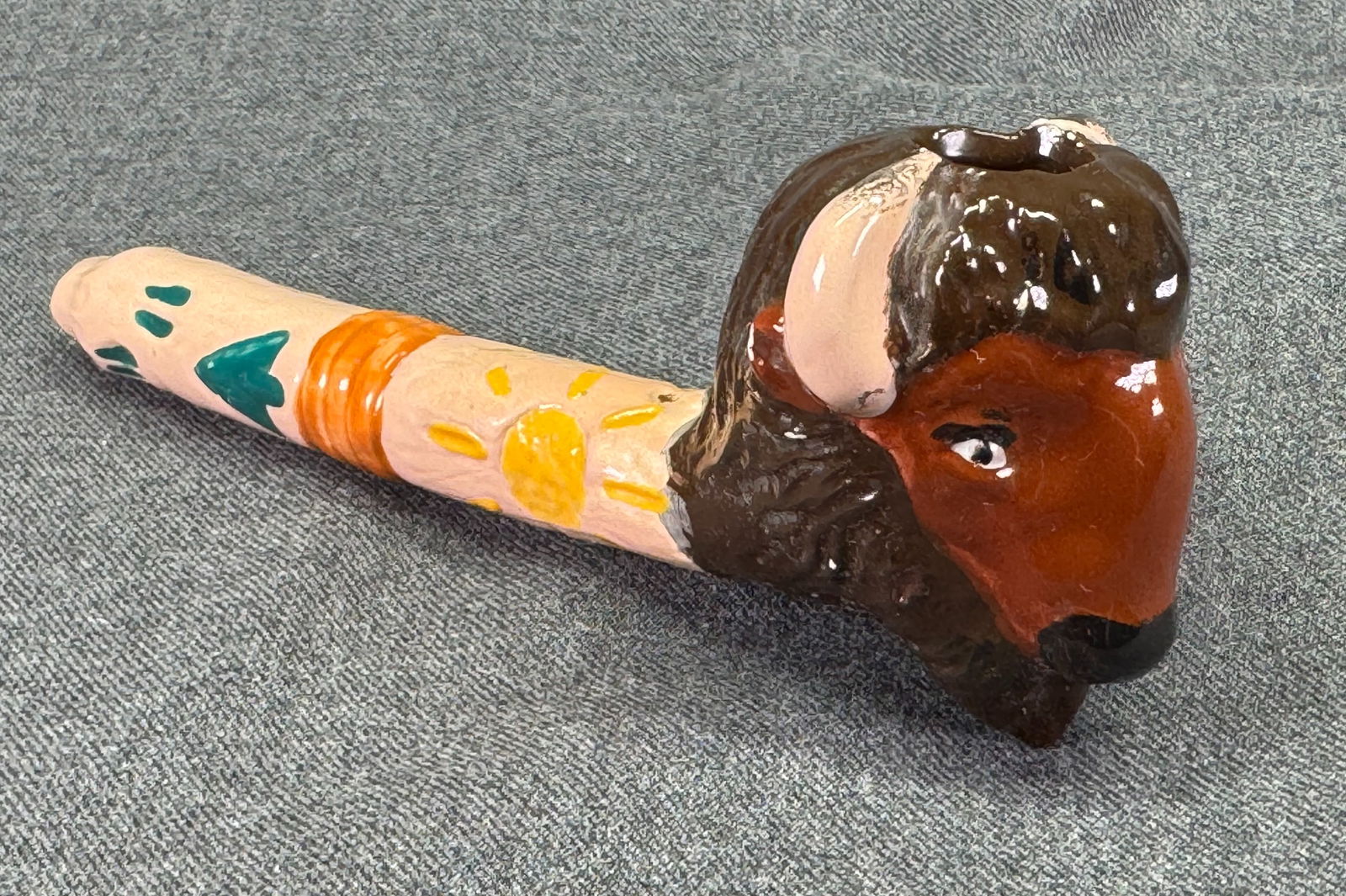 Native American Style Bison Pottery Pipe.: Native American Style bison Pottery Pipe. For measures please refer to the pictures taken with a measuring tape. IN HOUSE Estimated* SHIPPING & HANDLING COST WITHIN THE U.S. : $10 WE COMBINE SHIPPING.