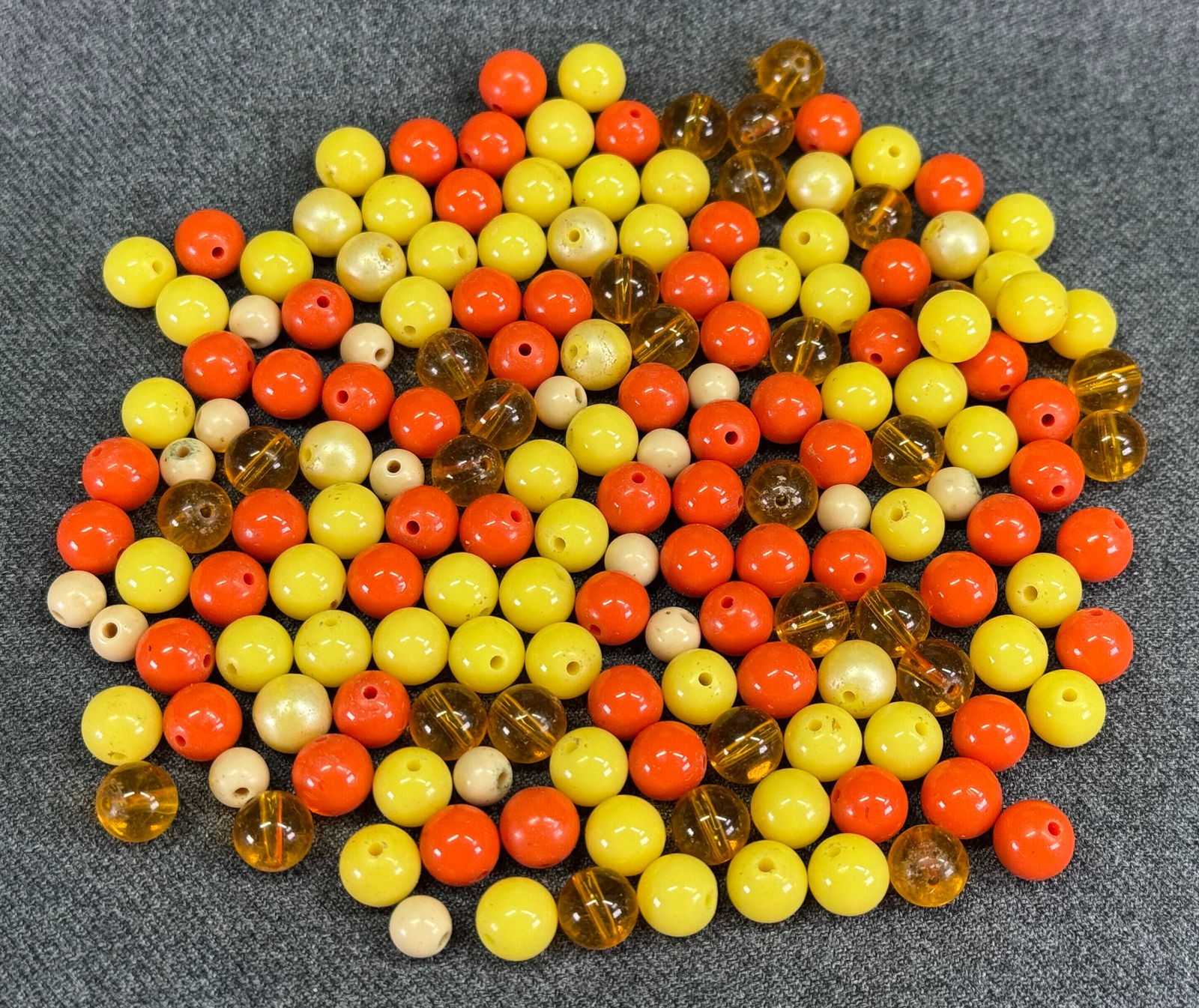 Vintage assorted orange, yellow, creamy and amber color plastic loose beads: IN HOUSE FLAT SHIPPING & HANDLING COST WITHIN ALL THE U.S. : $7 To bypass LiveShipping, and use our In-House shipping service for $7 or shipping combined for multiple lots, please select “Arrange Yo