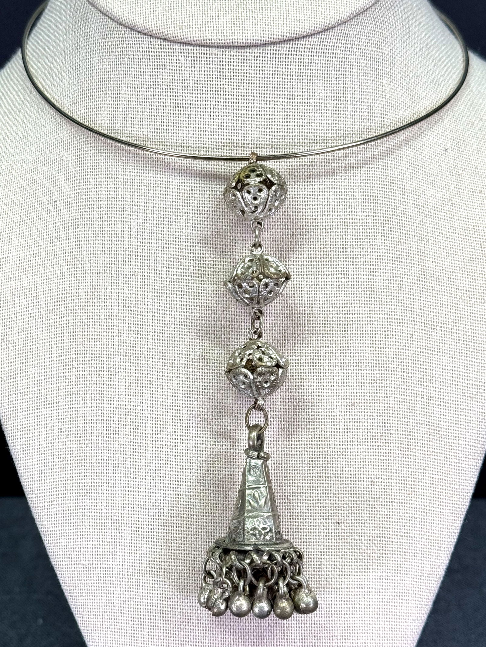 Vintage / antique tribal silver bells tassel pendant with a modern collar strap necklace: Vintage / antique tribal silver bells tassel pendant with a modern collar strap necklace. Unmarked. For measures please refer to the pictures taken with a measuring tape. Weight: 27 Grams. IN HOUSE Es