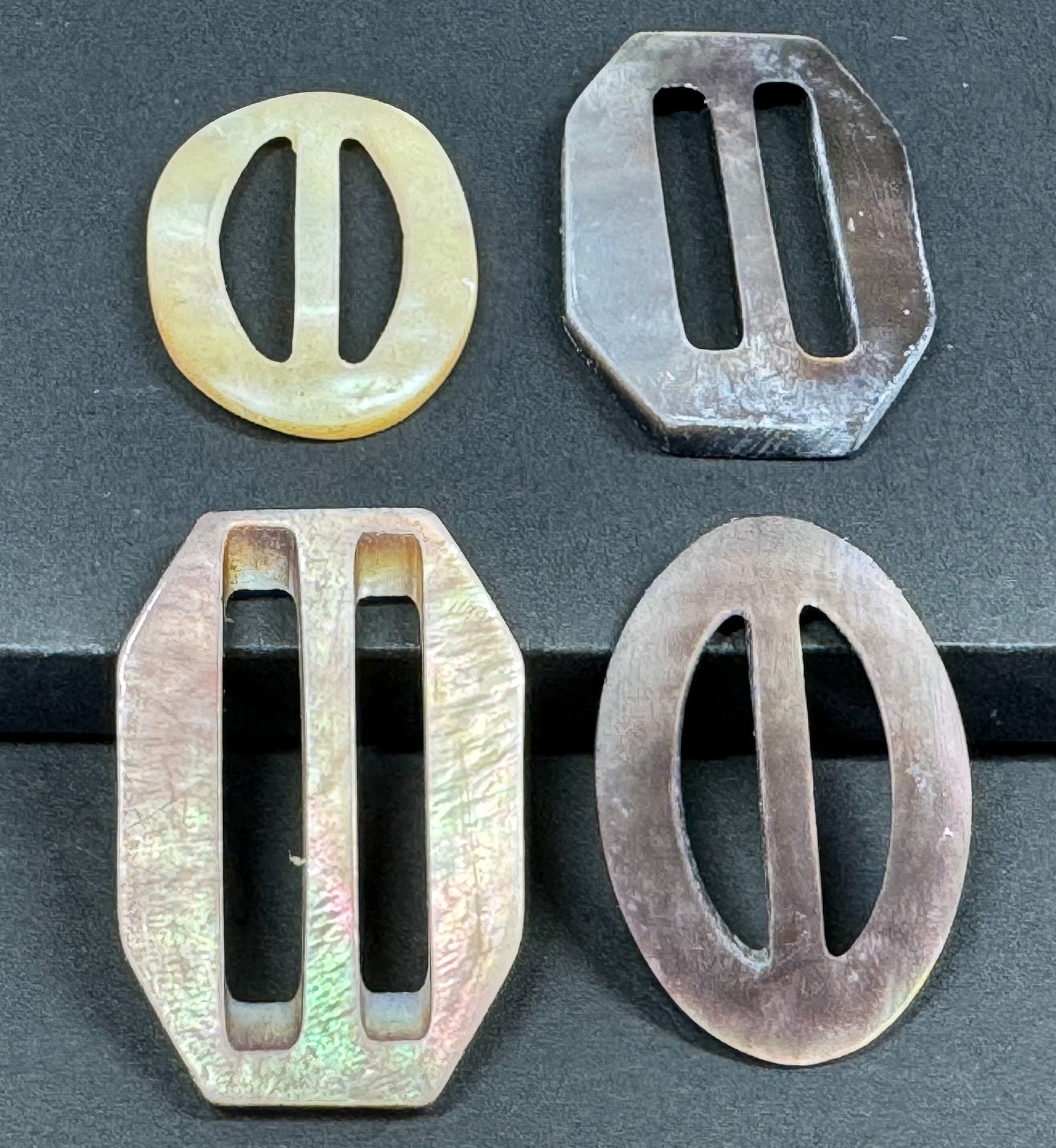 Antique victorian mother of pearl MOP small sliders belt buckles, Lot of 4.: Antique victorian mother of pearl MOP small sliders belt buckles, Lot of 4. Unmarked. For measures please refer to the pictures taken with a measuring tape. Weight: 7 Grams. < This is a NO RESERVE AUC