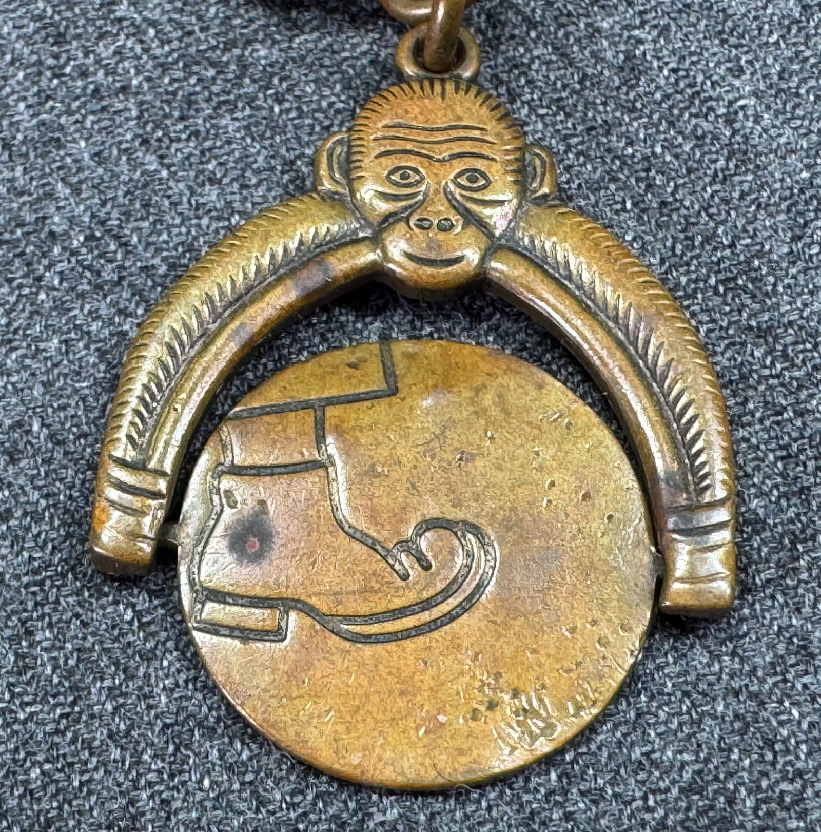 Antique Monkey Spinner Watch Fob Charm Pendant with Secret Kick in the Butt scene in key chain (1 of 9)
