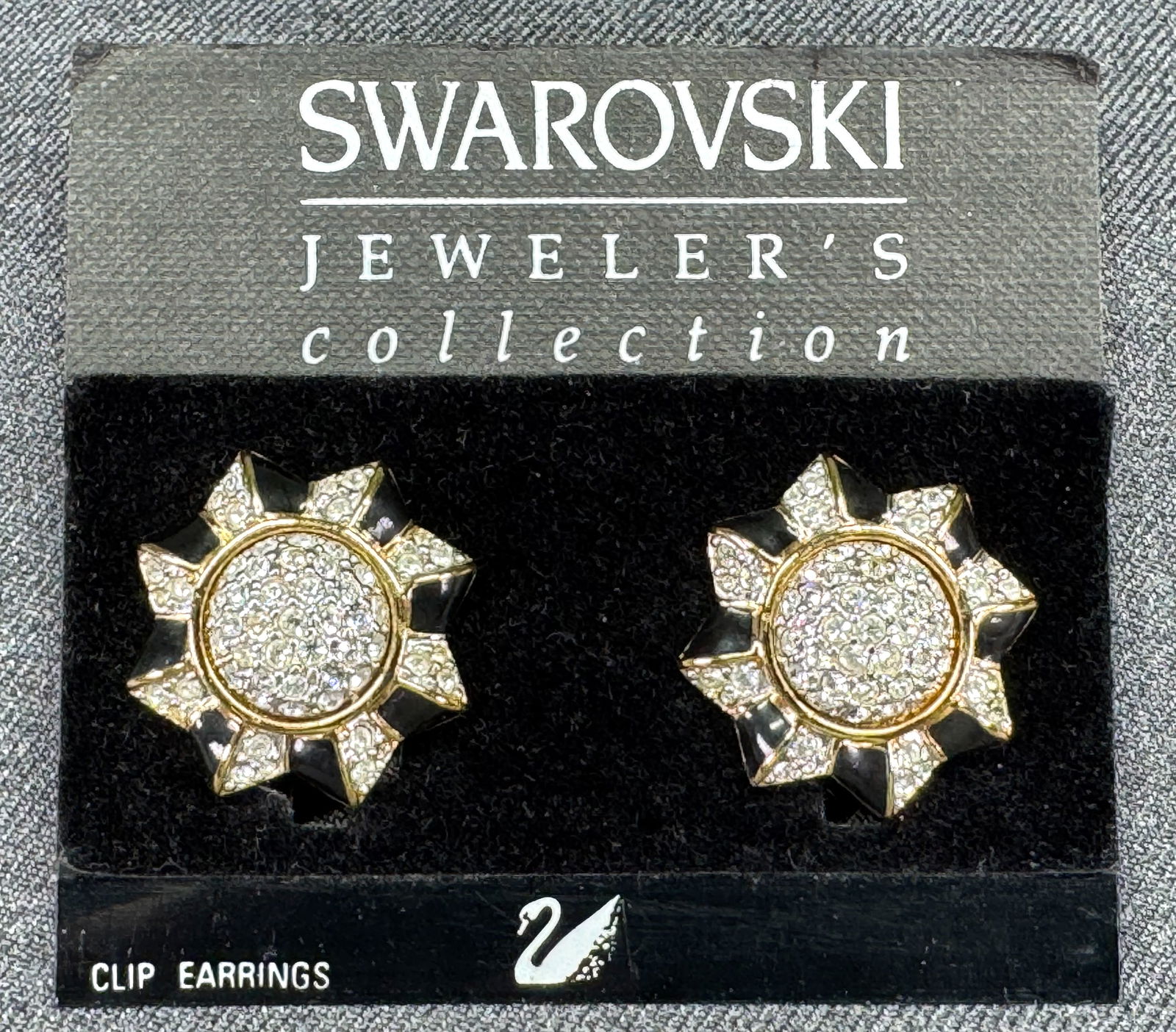 Vintage Swarovski black enamel, clear crystals gold-toned flower clip earrings in card: IN HOUSE FLAT SHIPPING & HANDLING COST WITHIN ALL THE U.S. : $7 To bypass LiveShipping, and use our In-House shipping service for $7 or shipping combined for multiple lots, please select “Arrange Yo