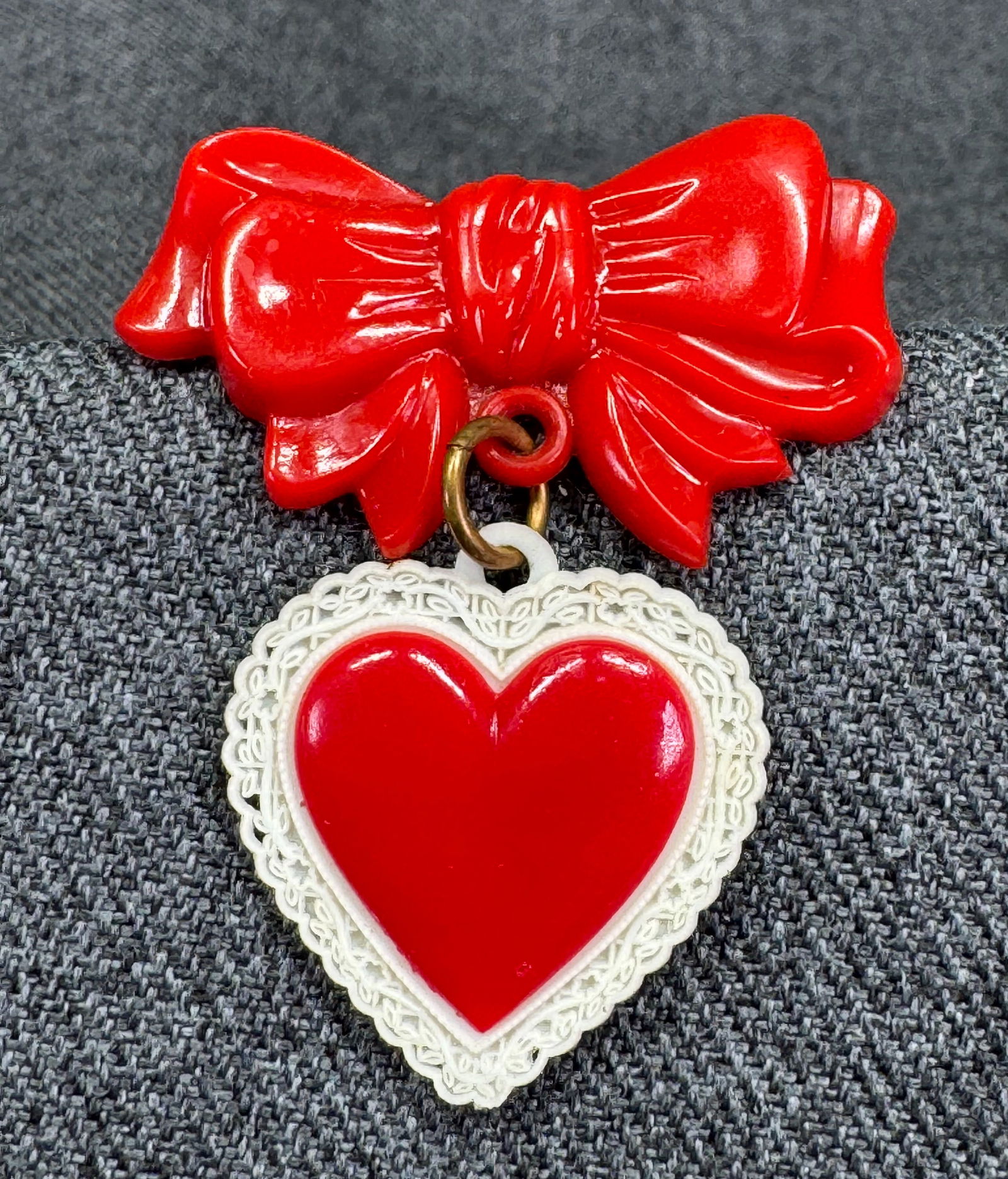 Vintage early plastic sweetheart bow with dangling filigree lace heart brooch pin: IN HOUSE FLAT SHIPPING & HANDLING COST WITHIN ALL THE U.S. : 7 To bypass LiveShipping, and use our In-House shipping service for 7 or shipping combined for multiple lots, please select “Arrange