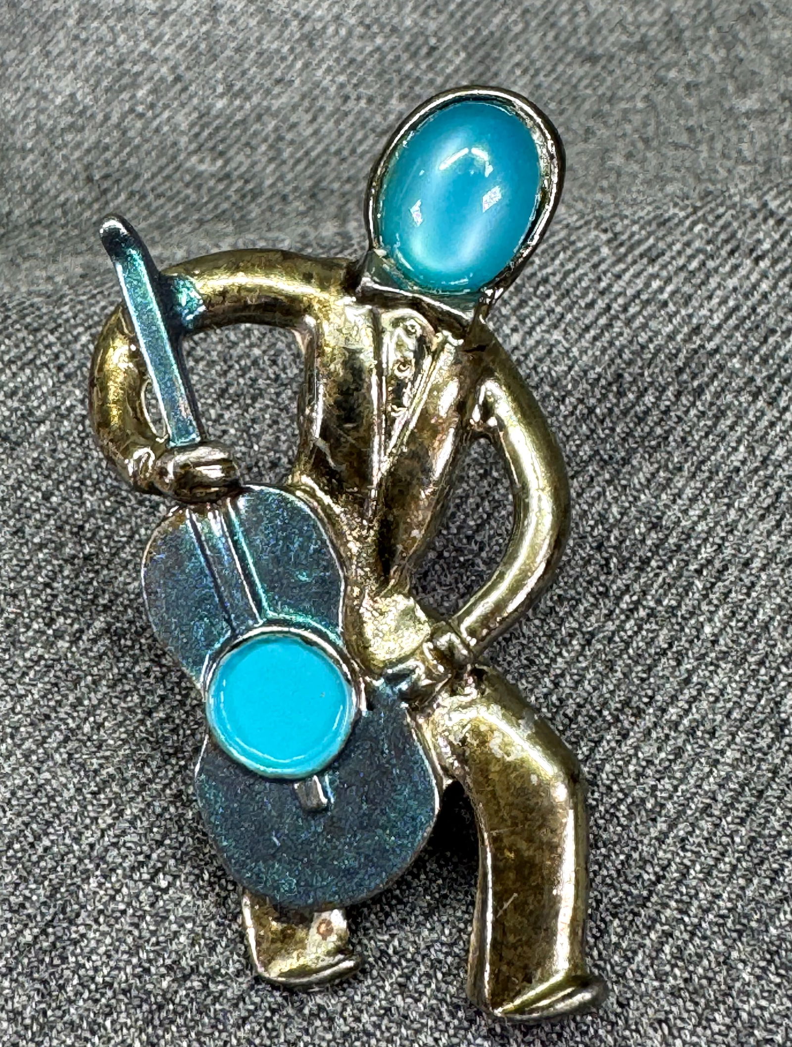 Vintage lucite and enamel gunmetal cello player brooch pin. V: IN HOUSE FLAT SHIPPING & HANDLING COST WITHIN ALL THE U.S. : 7 To bypass LiveShipping, and use our In-House shipping service for 7 or shipping combined for multiple lots, please select “Arrange