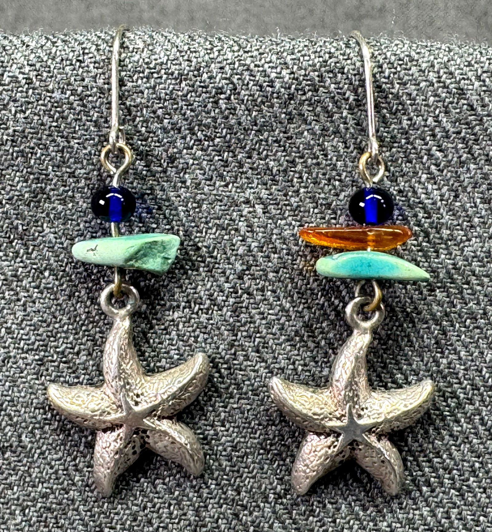 Vintage artsy resin beads starfish sterling silver hook earrings: Vintage artsy resin beads starfish sterling silver hook earrings. Marked artist unreadable tiny mark & 925. For measures please refer to the pictures taken with a measuring tape. Weight: 3.59 Grams .