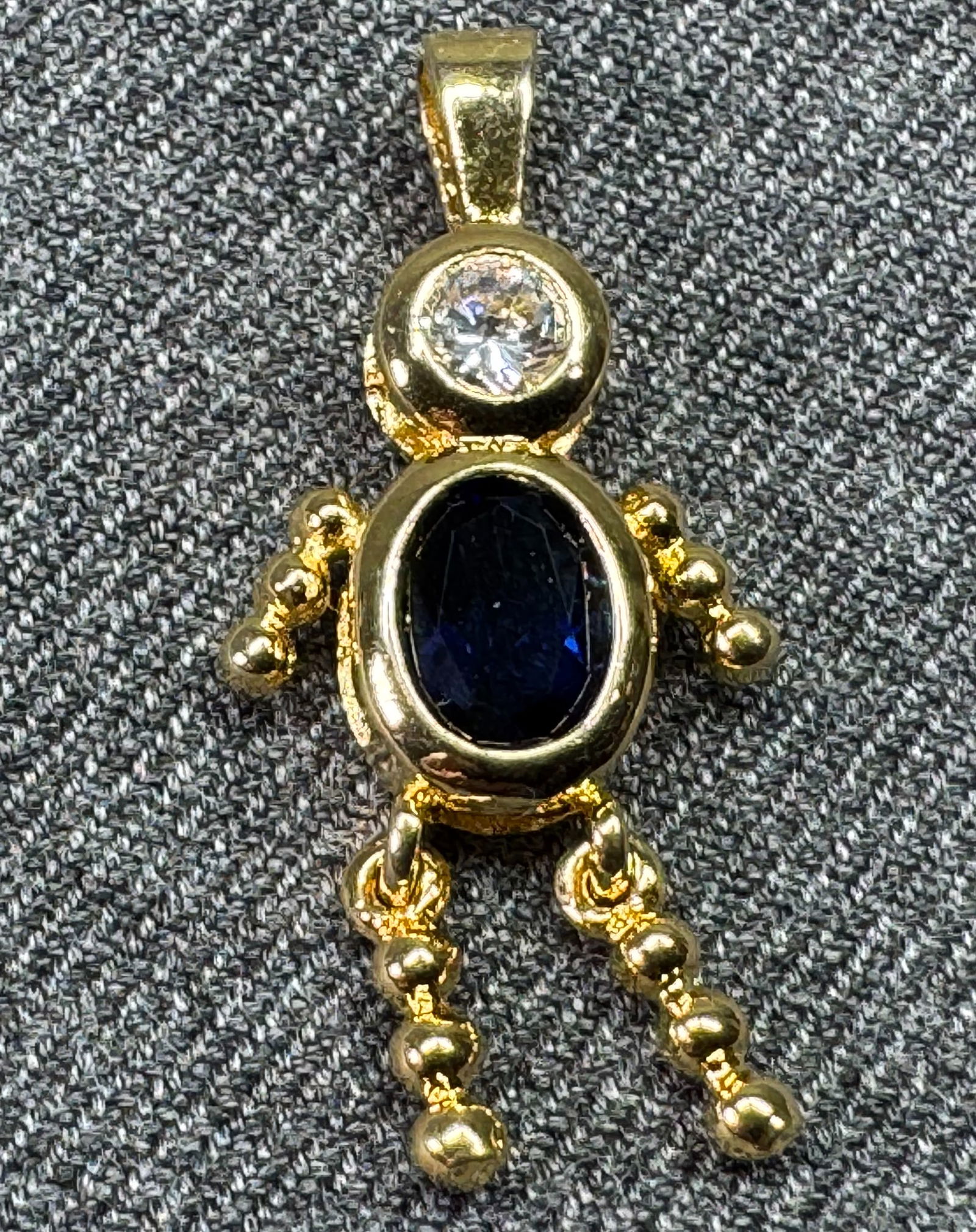 Vintage NC gilt sterling blue crystal birth stone baby bracelet charm pendant: Vintage NC gilt sterling blue crystal birth stone baby bracelet charm pendant. Marked NF 925. For measures please refer to the pictures taken with a measuring tape. Weight: 2.19 Grams . IN HOUSE FLAT