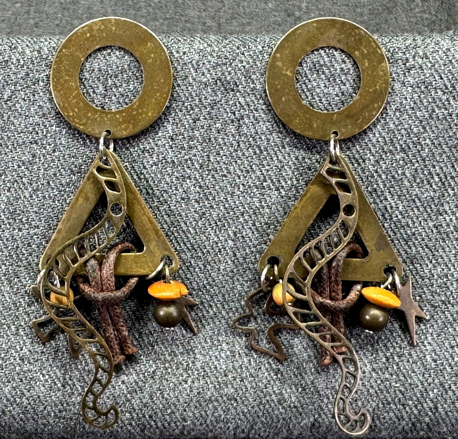 Vintage boho SW style cord, bronzed-plated snake, dove, star dangles stud earrings: Vintage boho SW style cord, bronzed-plated snake, dove, star dangles stud earrings. Unmarked. For measures please refer to the pictures taken with a measuring tape. Weight: 15 Grams . IN HOUSE FLAT SH