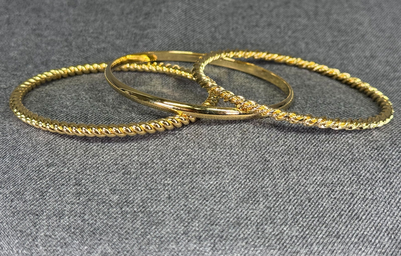 Vintage 80s goldtone metal twisted and curved bracelet bangles. Lot of 3 (1 of 6)