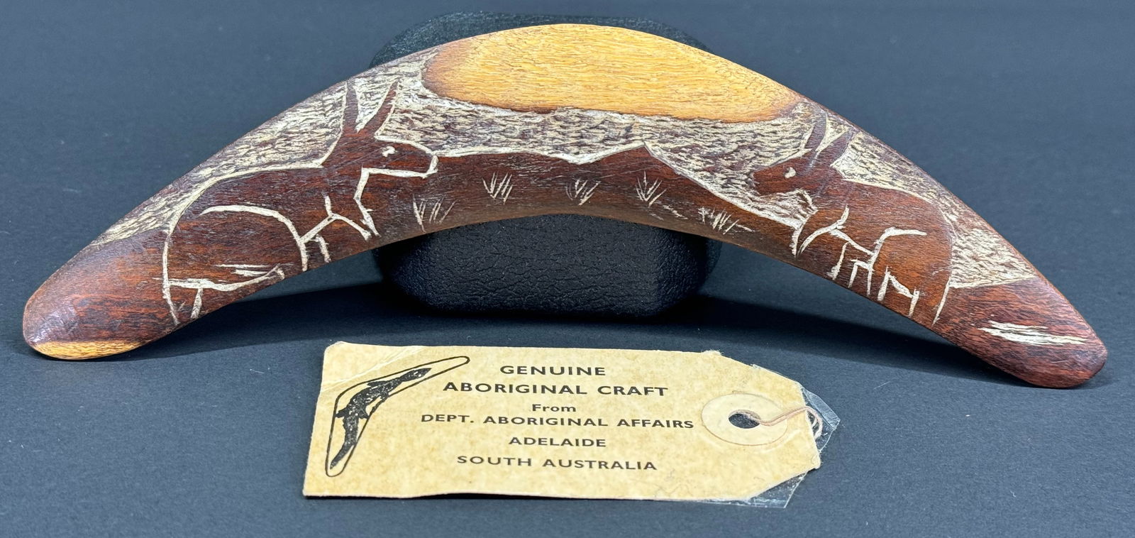 Vintage Aboriginal Australia Miniature Boomerang. Carved and decorated wood. Paper label. (1 of 8)