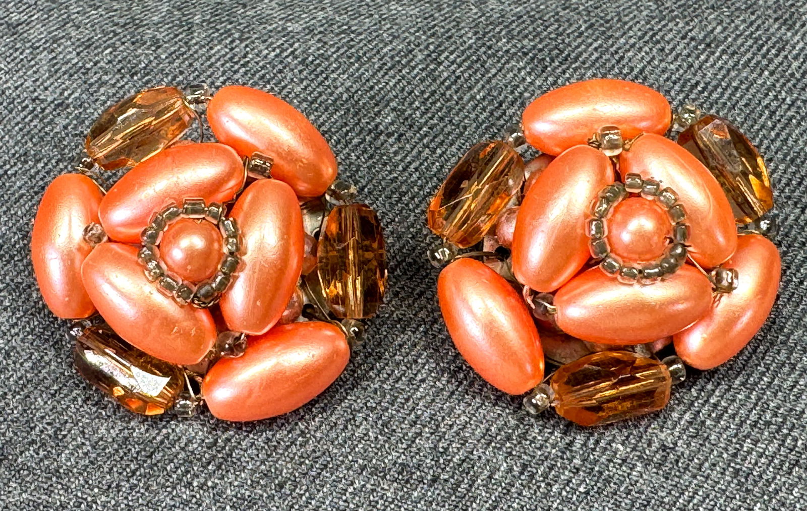 Vintage pearly & glass wired beads clip earrings. Japan: Vintage pearly & glass wired beads clip earrings. Silver-toned back. Marked Japan. For measures please refer to the pictures taken with a measuring tape. Weight:15 Grams. IN HOUSE FLAT SHIPPING & HAND