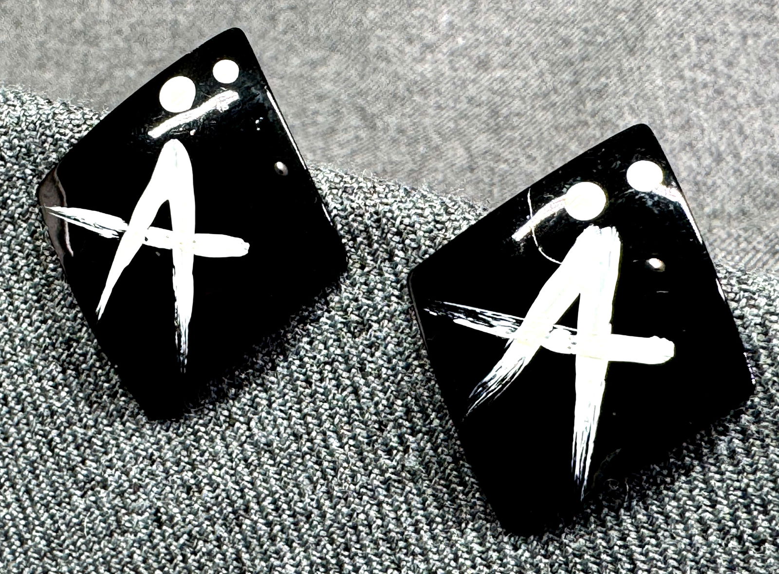 Vintage letter A enamel metal stud earrings: Vintage letter A enamel metal stud earrings. Unmarked . For measures please refer to the pictures taken with a measuring tape. Weight: 4 Grams. IN HOUSE FLAT SHIPPING & HANDLING COST WITHIN ALL THE U.