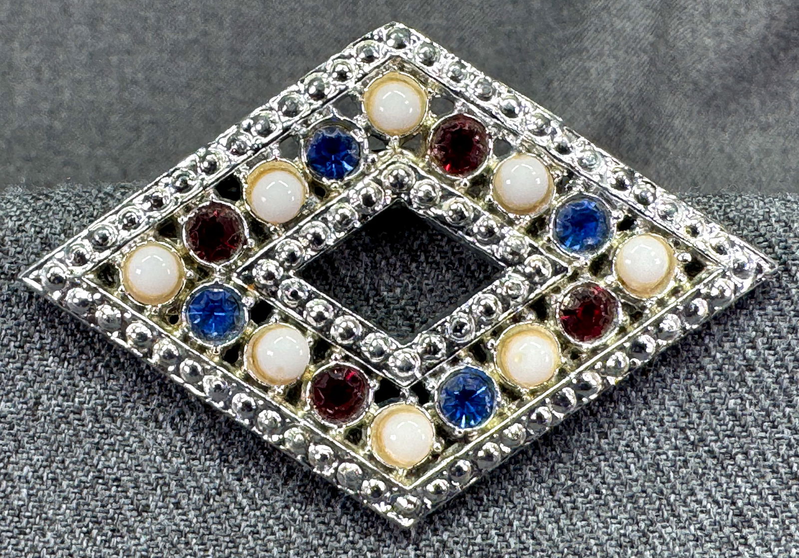 Vintage WMCA patriotic silver-toned metal brooch pin: Vintage WMCA patriotic silver-toned metal brooch pin. Unmarked . For measures please refer to the pictures taken with a measuring tape. Weight: 20 Grams. IN HOUSE FLAT SHIPPING & HANDLING COST WITHIN