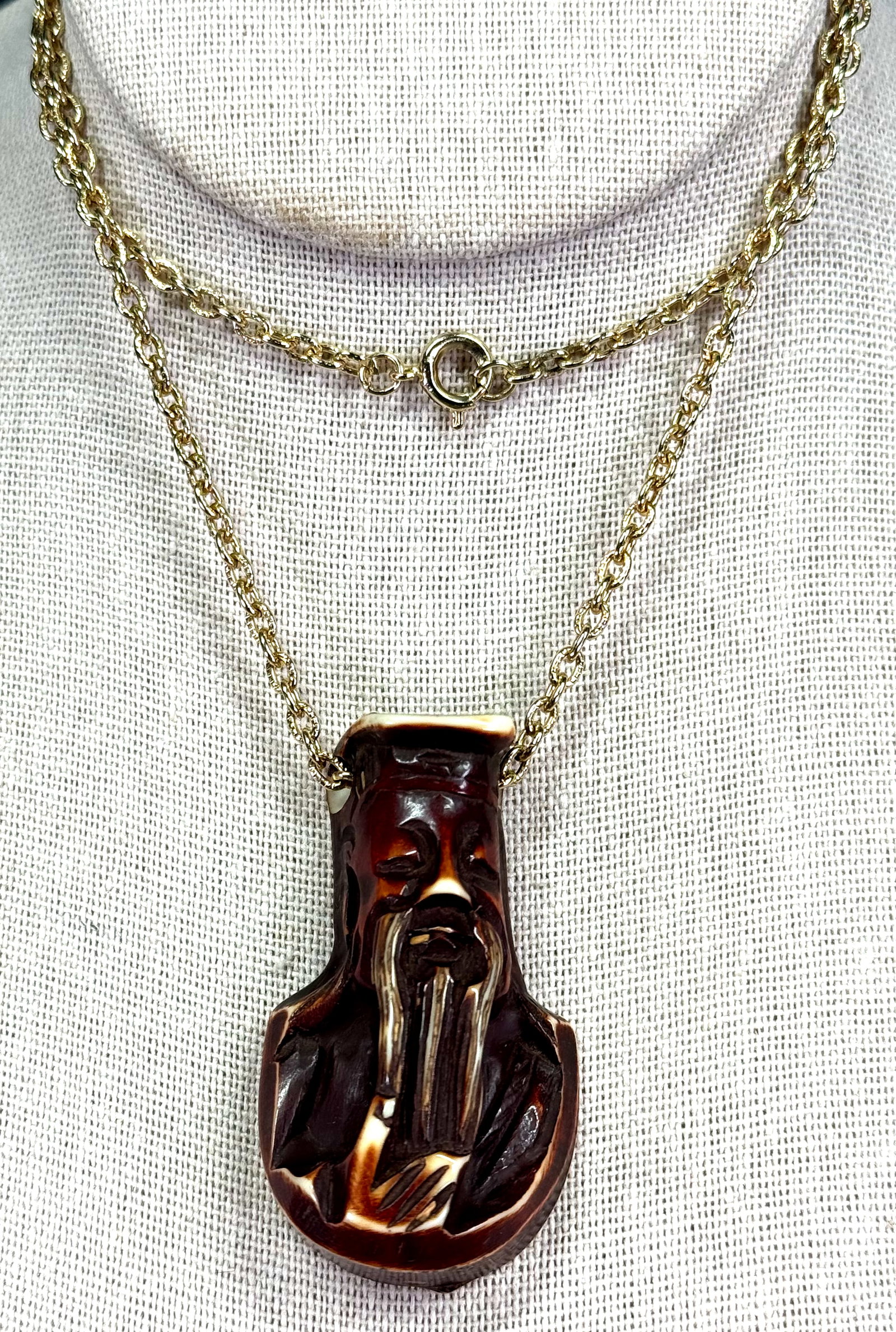 Vintage dyed and carved plastic oriental man pendat with goldtone metal chain strap necklace: IN HOUSE FLAT SHIPPING & HANDLING COST WITHIN ALL THE U.S. : $7 To bypass LiveShipping, and use our In-House shipping service for $7 or shipping combined for multiple lots, please select “Arrange Yo