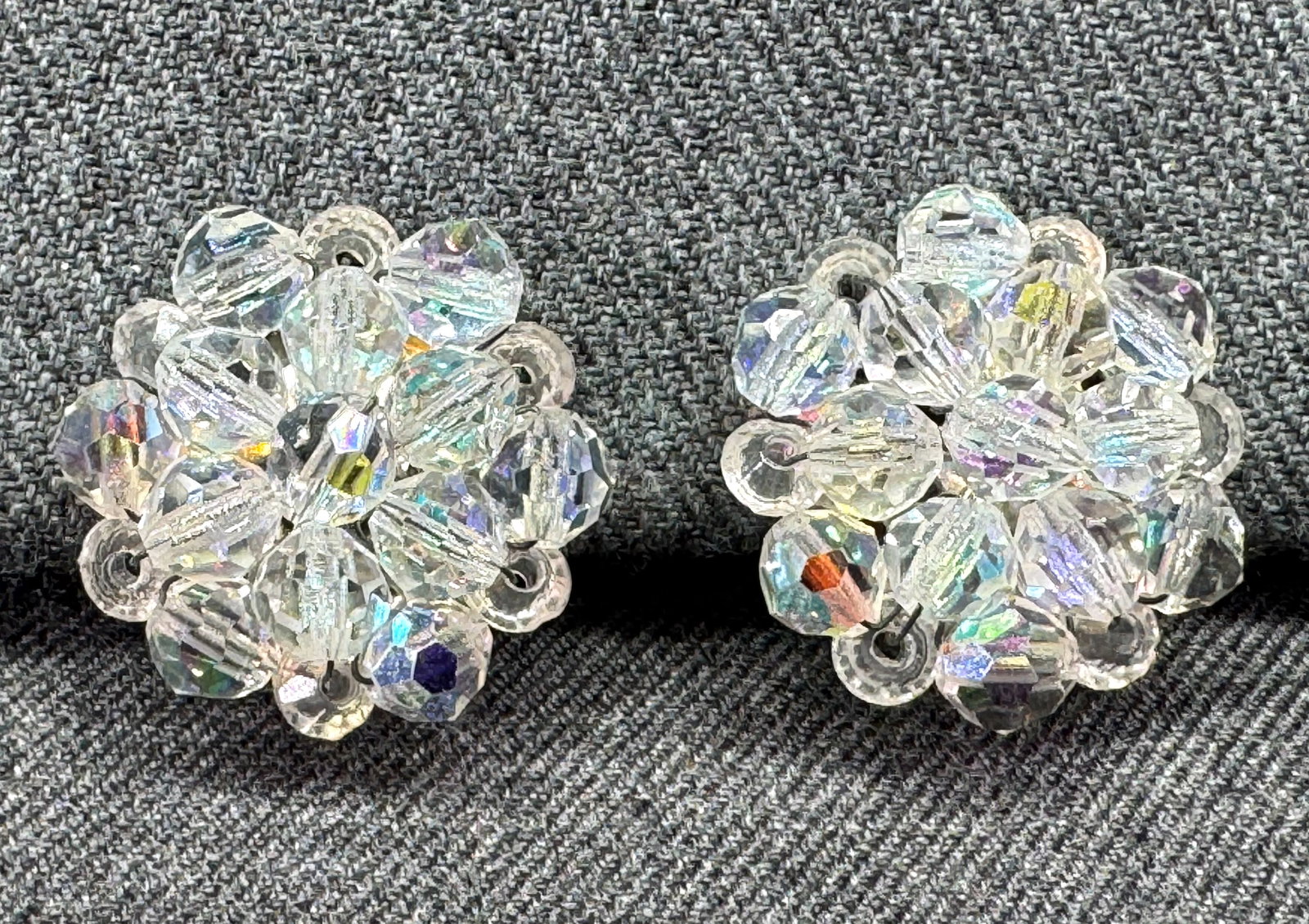 Vintage AB crystals cluster flower clip on earrings: Vintage AB crystals cluster flower clip on earrings. Unmarked. For measures please refer to the pictures taken with a measuring tape. Weight: 16 Grams . IN HOUSE FLAT SHIPPING & HANDLING COST WITHIN A