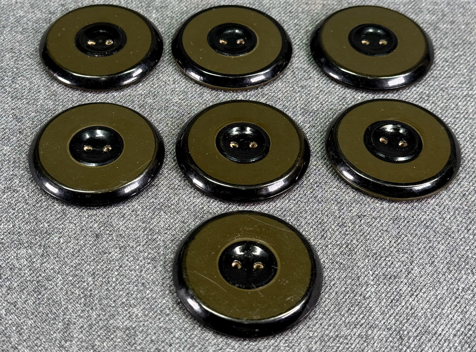 Antique art deco dark olive green and black celluloid cardboard back buttons. Lot of 10 (1 of 5)