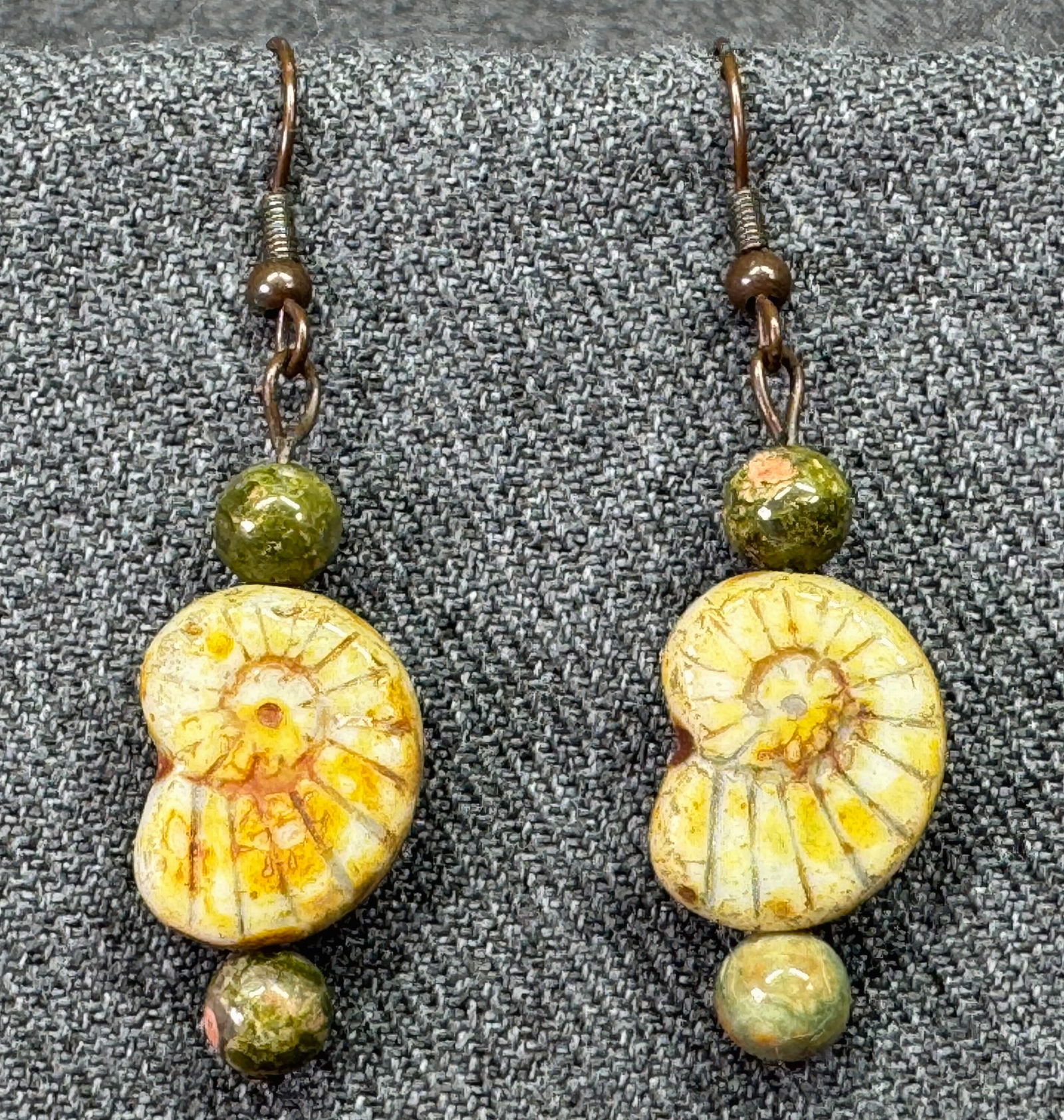 Vintage unakite stone & Czech glass nautilus beads hook earrings. a: Vintage unakite stone & Czech glass nautilus beads hook earrings. Unmarked. For measures please refer to the pictures taken with a measuring tape. Weight: 7 Grams. IN HOUSE FLAT SHIPPING & HANDLING CO